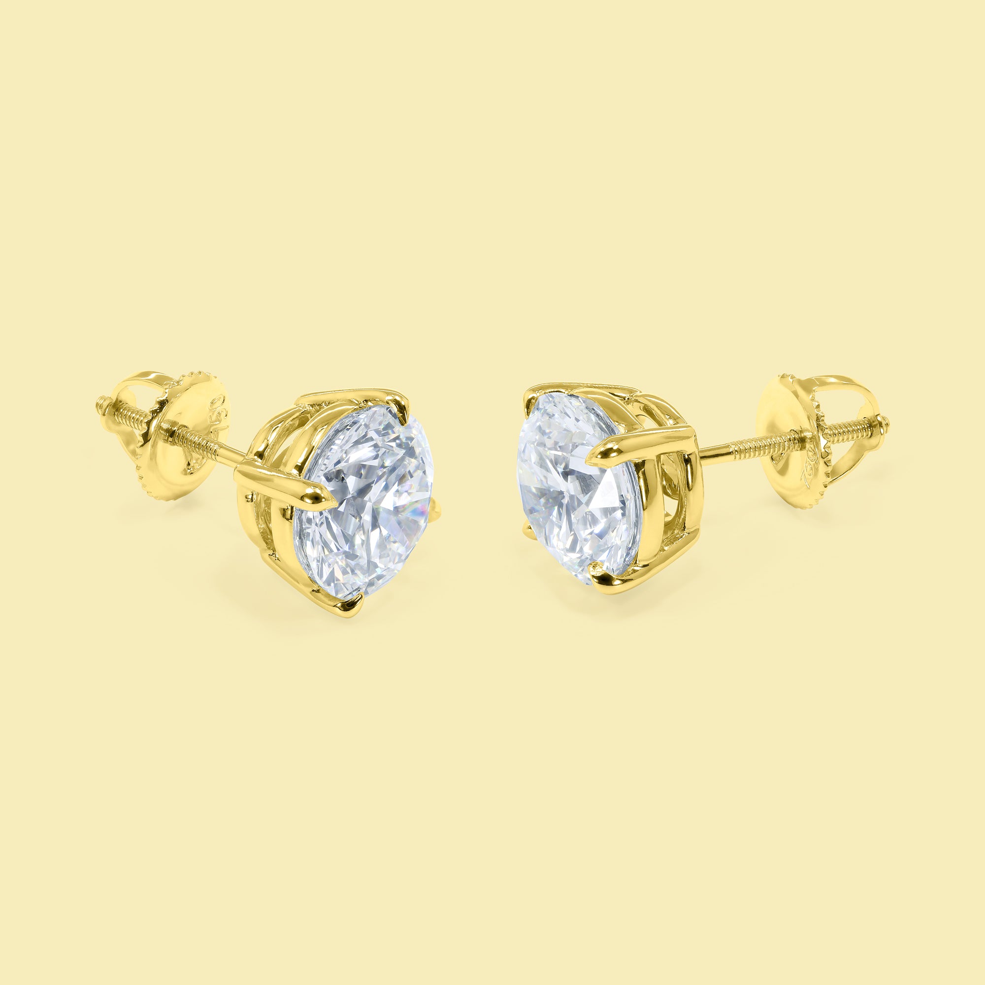 The Audrey, Classic Solitaire Basket Diamond Stud Earrings are in 14K gold, 18K gold, or Platinum by Earthena Jewelry of Beverly Hills, California.