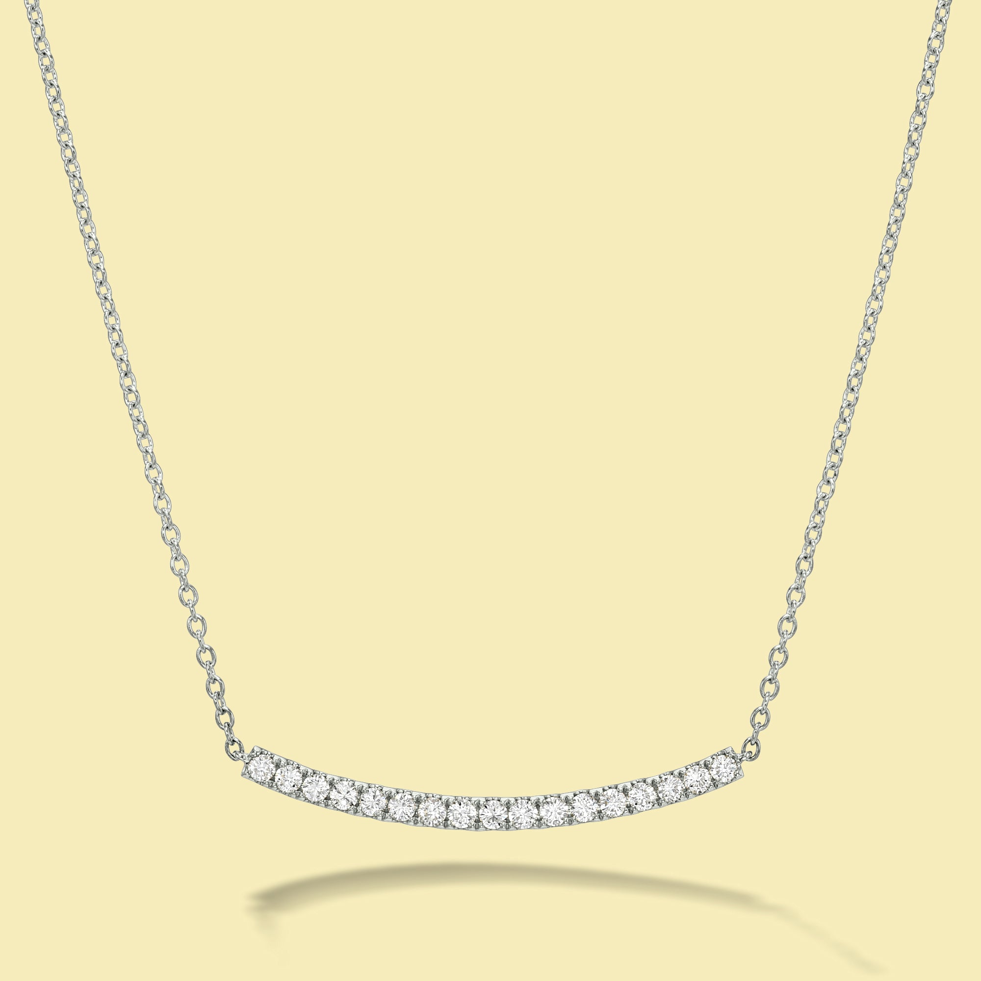 The Ace, Curved Bar Diamond Necklace is handcrafted in 14K Gold, 18K Gold, or Platinum by Earthena Jewelry in Los Angeles