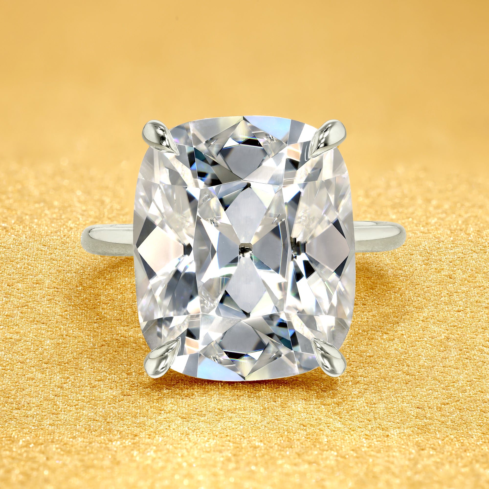 The Adara Elongated Old Mine Cushion-cut Hidden Halo Moissanite Engagement Ring, a classic look with an elegant twist complemented by Lab Diamonds handcrafted in 14K gold, 18K gold, or Platinum by Earthena Jewelry of Beverly Hills.