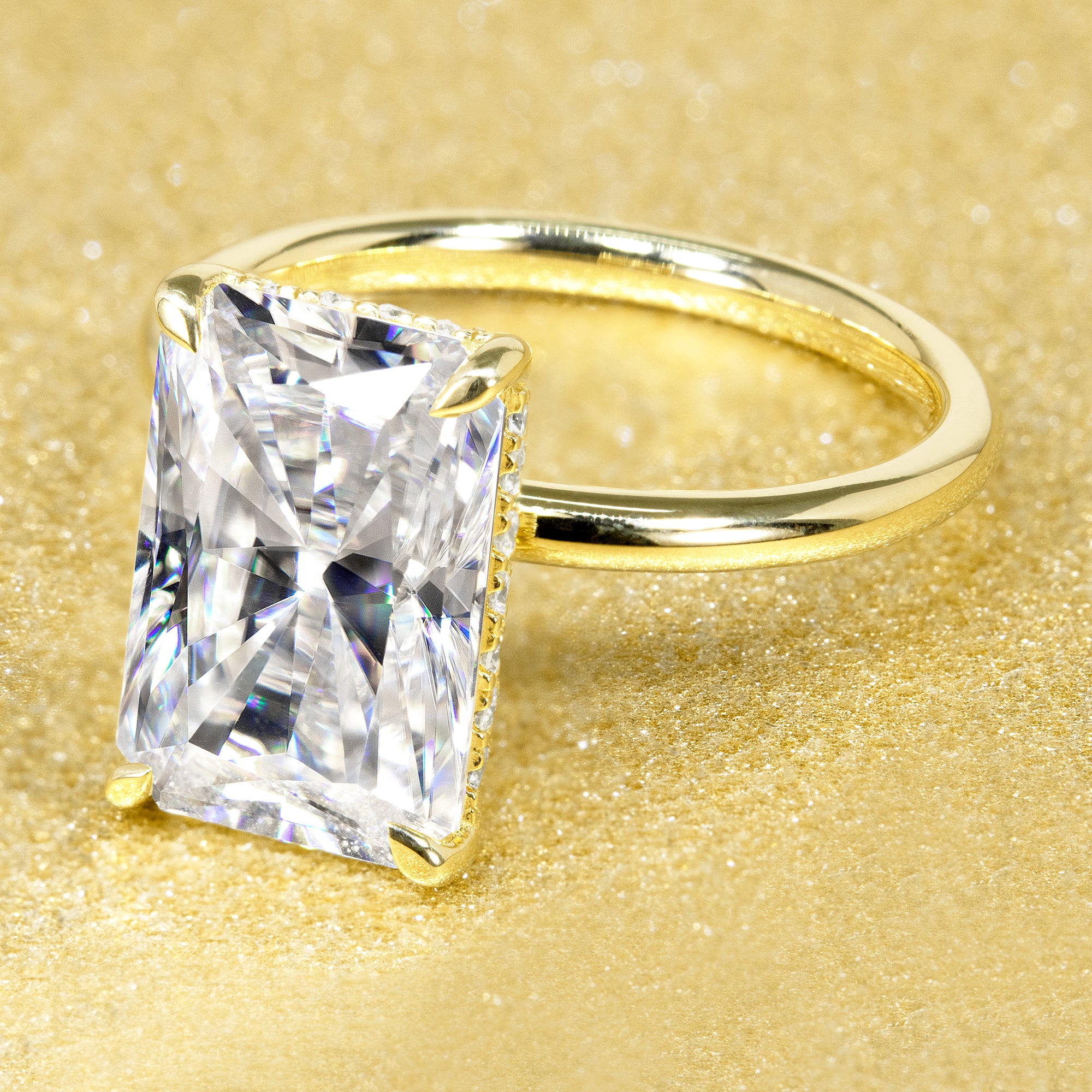 The Adara, 4.5ct Elongated Radiant-Cut Lab-Grown Diamond Hidden Halo Engagement Ring in 14K Gold, 18K Gold, or Platinum by Earthena Jewelry of Beverly Hills.