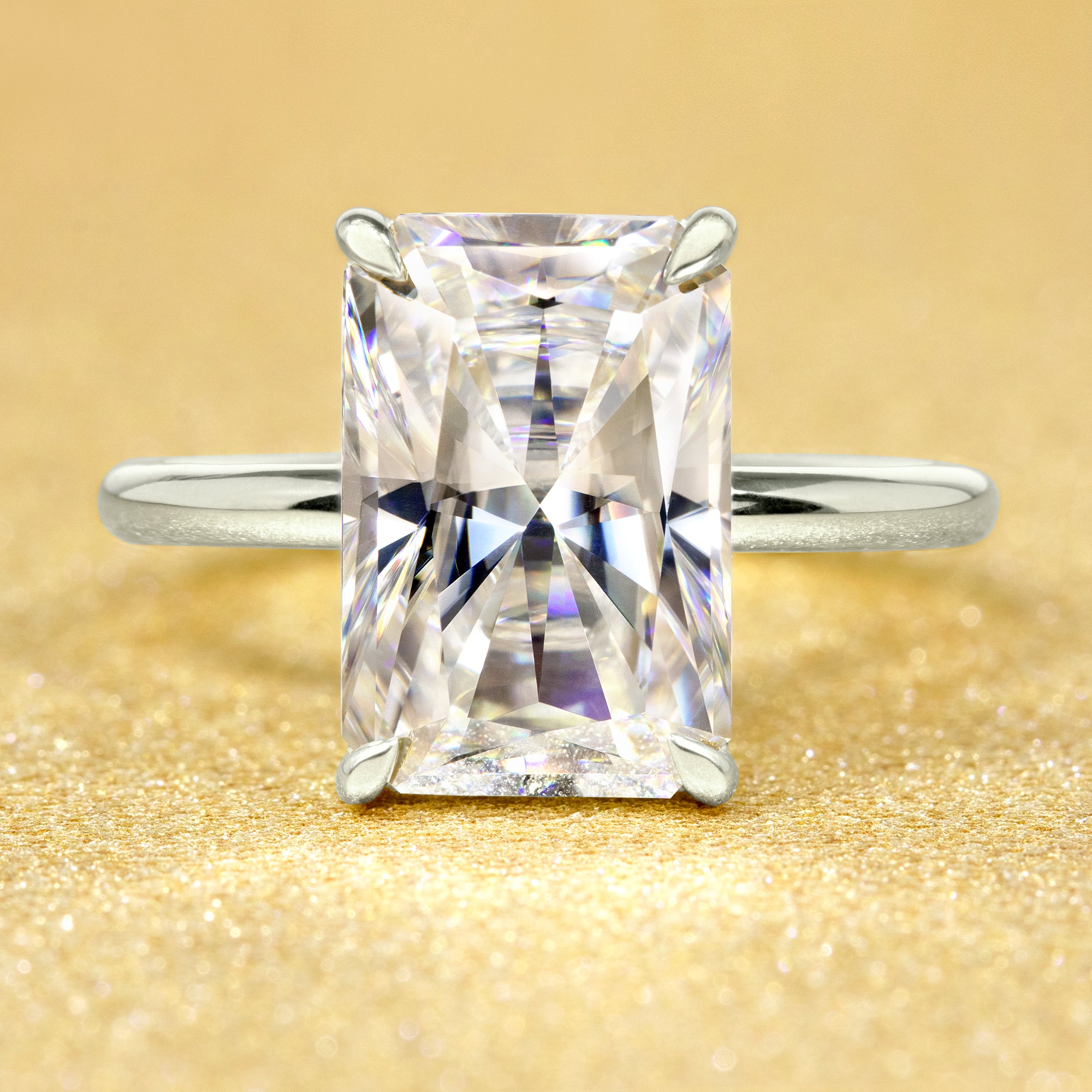 The Adara, 4.5ct Elongated Radiant-Cut Lab-Grown Diamond Hidden Halo Engagement Ring in 14K Gold, 18K Gold, or Platinum by Earthena Jewelry of Beverly Hills.