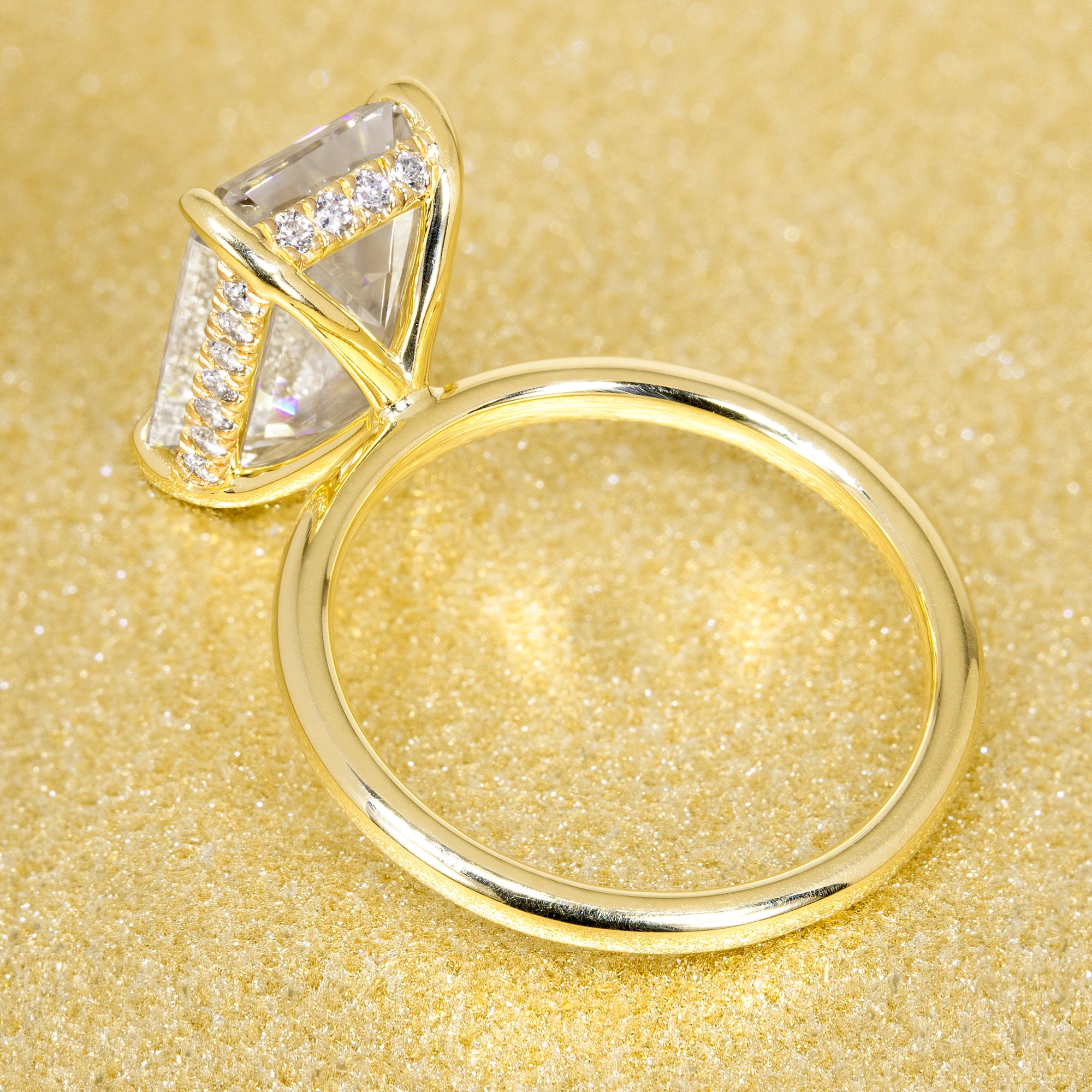 The Adara Elongated Emerald-cut Hidden Halo Moissanite Lab-grown Diamonds Engagement Ring handcrafted in 14K or 18K Gold handcrafted in Los Angeles by Earthena Jewelry.