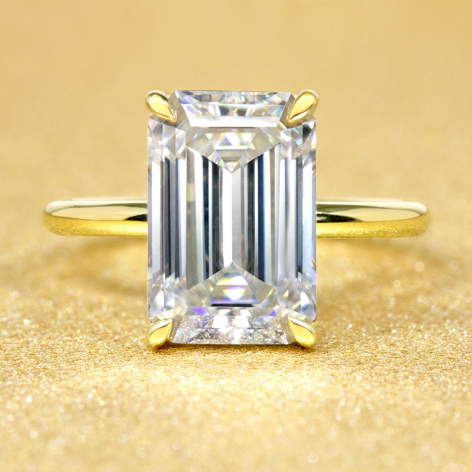 The Adara Elongated Emerald-cut Hidden Halo Moissanite Lab-grown Diamonds Engagement Ring handcrafted in 14K or 18K Gold handcrafted in Los Angeles by Earthena Jewelry.