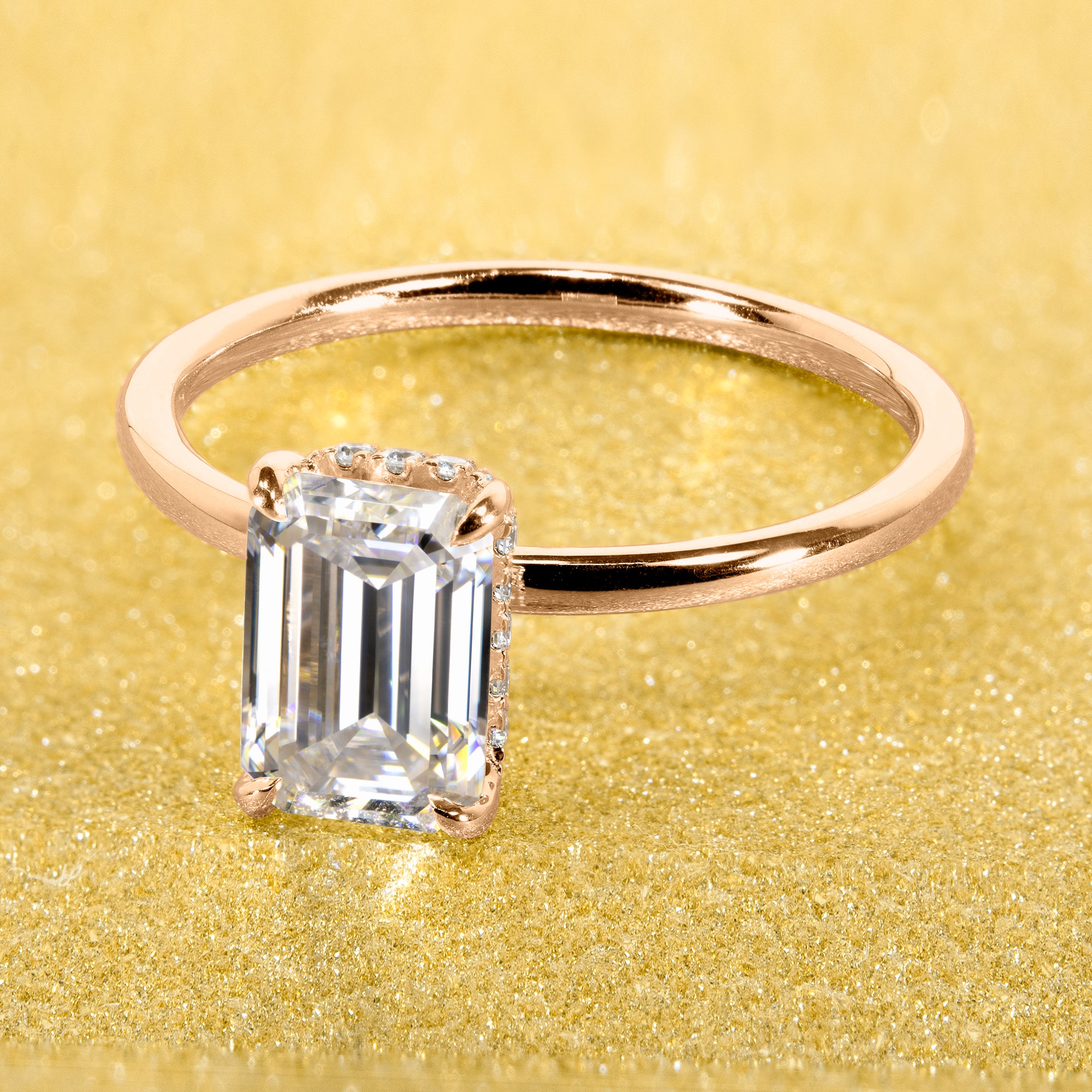 Classic and Minimalistic Ariela 1.5ct Elongated Emerald-cut Moissante Halo Solitaire Engagement ring complemented by Lab Diamonds handcrafted in 14K Gold, 18K Gold, or Platinum by Earthena Jewelry of Beverly Hills.