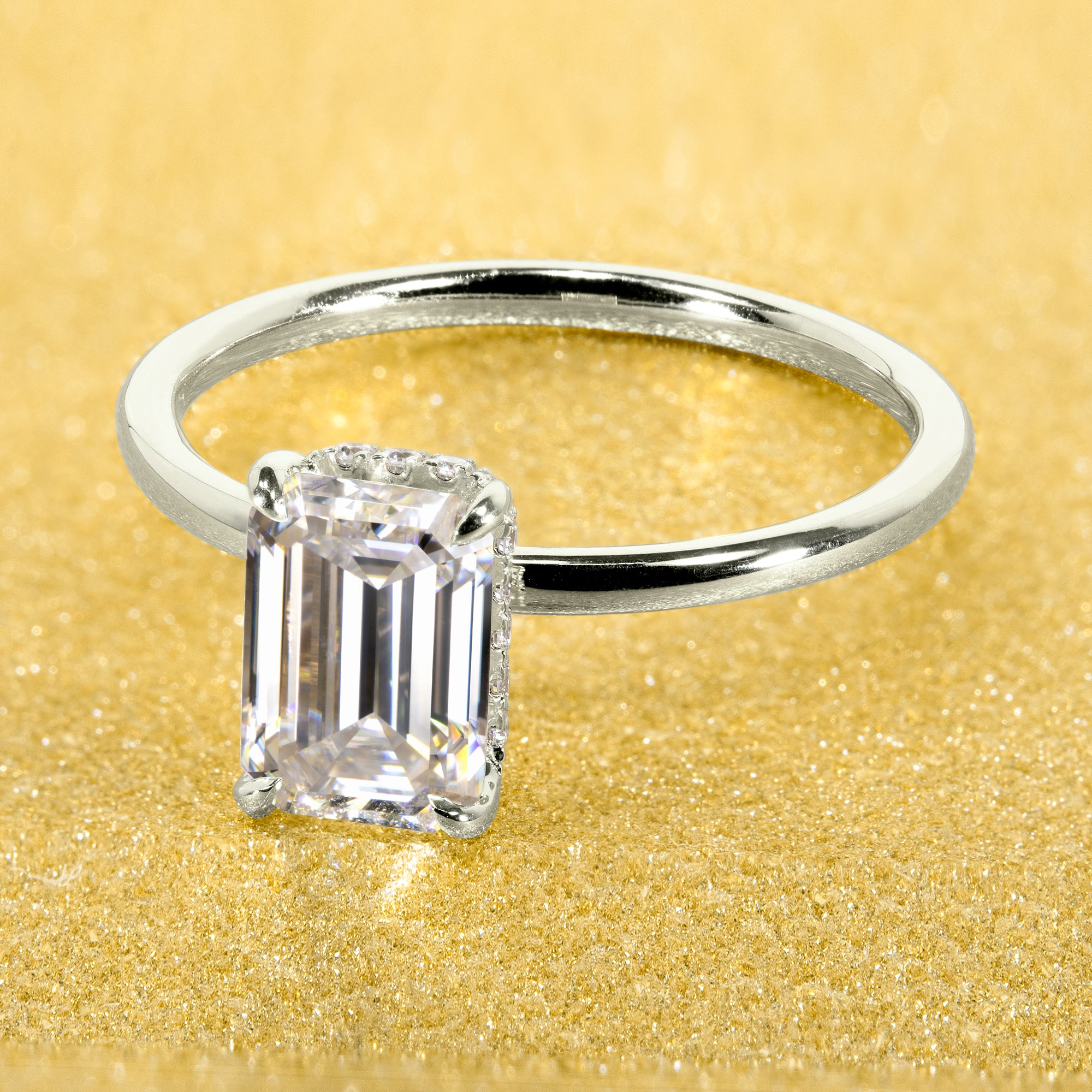 Classic and Minimalistic Ariela 1.5ct Elongated Emerald-cut Moissante Halo Solitaire Engagement ring complemented by Lab Diamonds handcrafted in 14K Gold, 18K Gold, or Platinum by Earthena Jewelry of Beverly Hills.