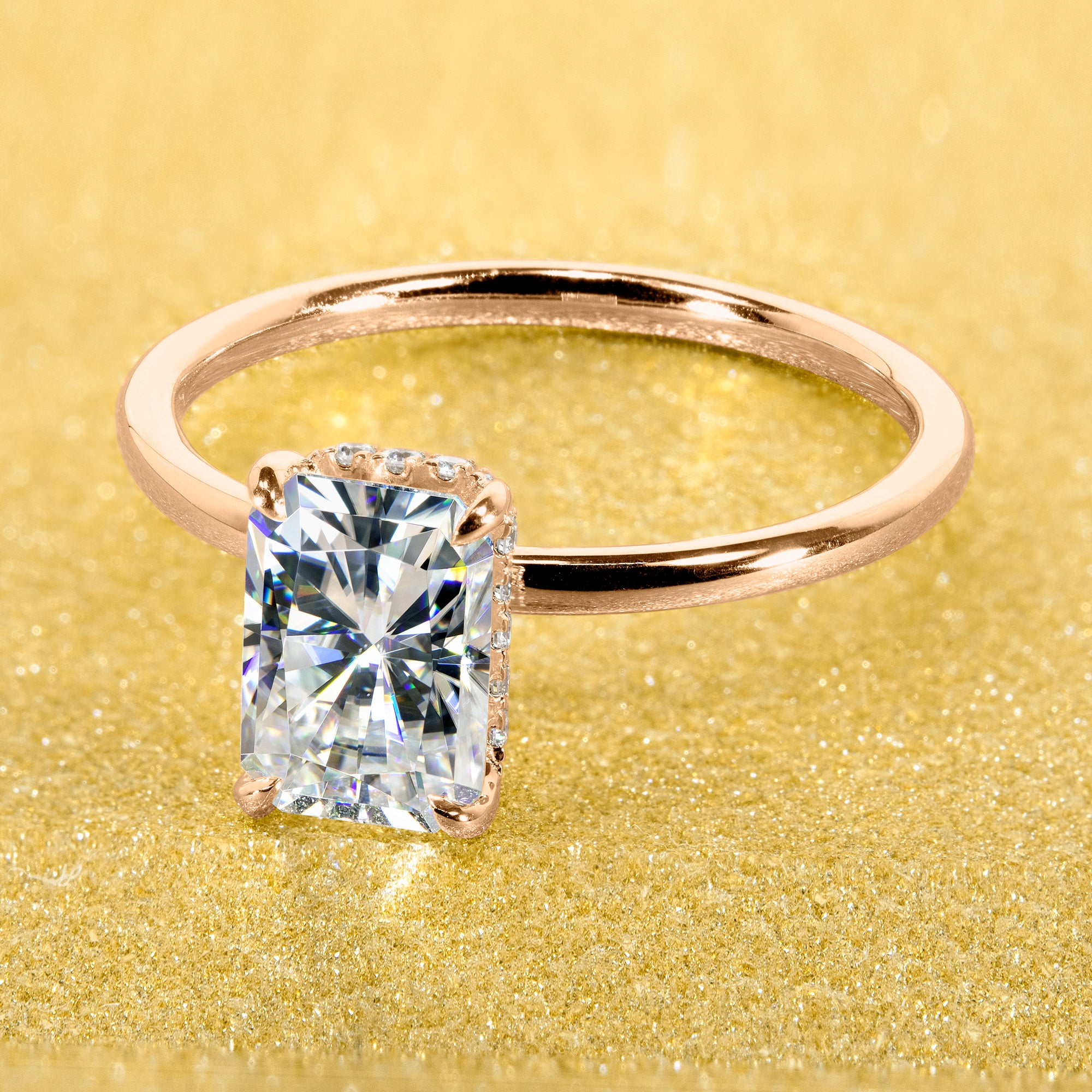 Classic and Minimalistic Ariela 1.5ct Elongated Radiant-cut Moissanite Halo Solitaire Engagement ring complemented by Lab Diamonds handcrafted in 14K Gold, 18K Gold, or Platinum by Earthena Jewelry of Beverly Hills.