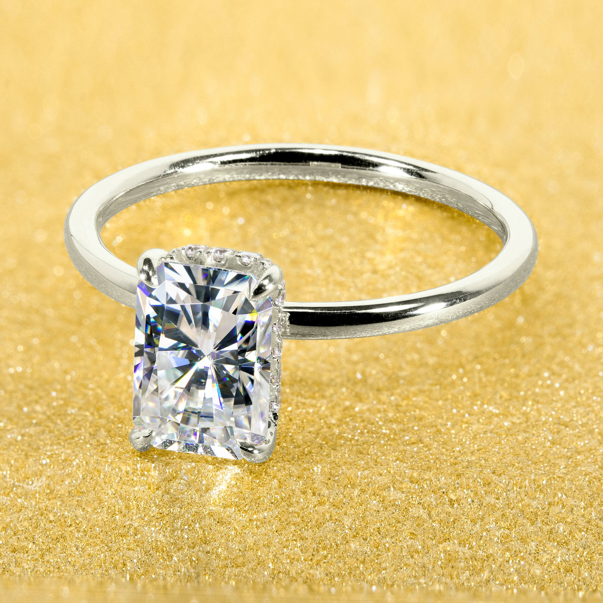 Classic and Minimalistic Ariela 1.5ct Elongated Radiant-cut Moissanite Halo Solitaire Engagement ring complemented by Lab Diamonds handcrafted in 14K Gold, 18K Gold, or Platinum by Earthena Jewelry of Beverly Hills.