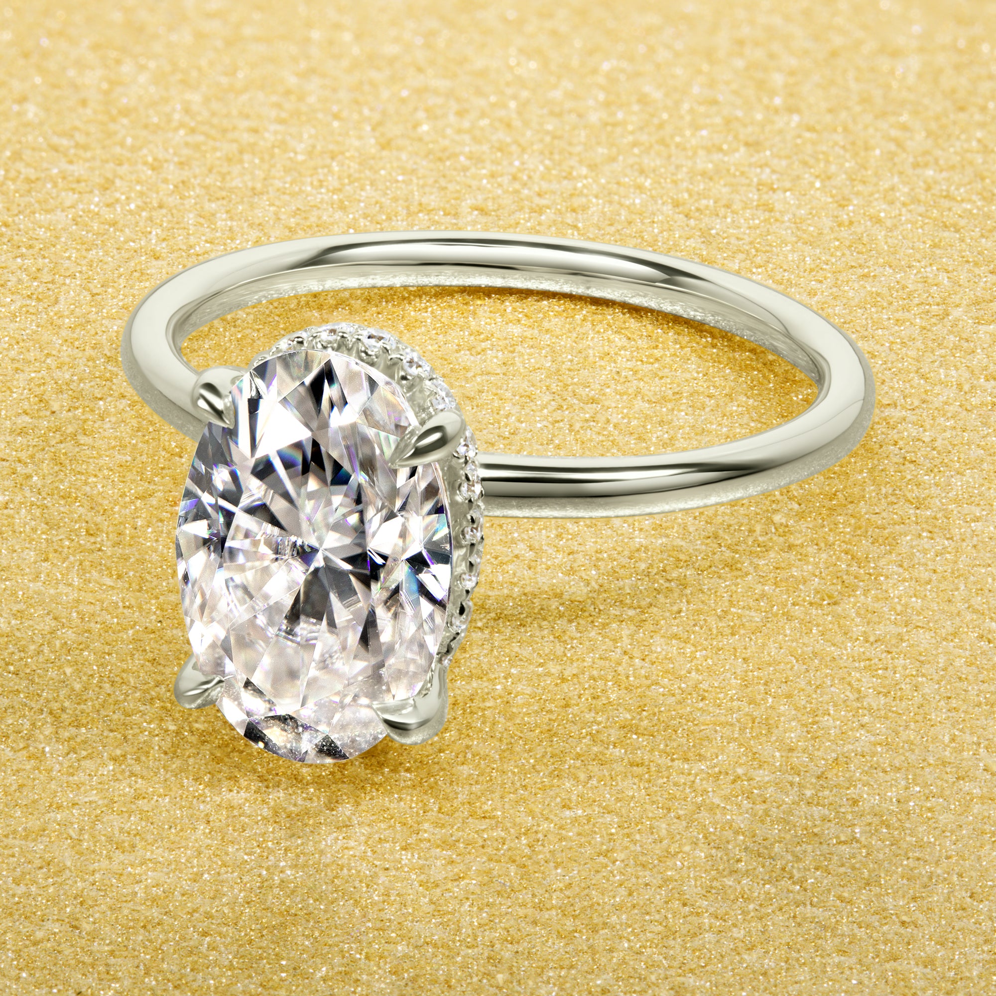Classic Ariela 3ct Elongated Oval-cut Moissanite and Lab Diamond Hidden Halo Solitaire ring in 14K Gold, 18K Gold, or Platinum by Earthena Jewelry of Beverly Hills.