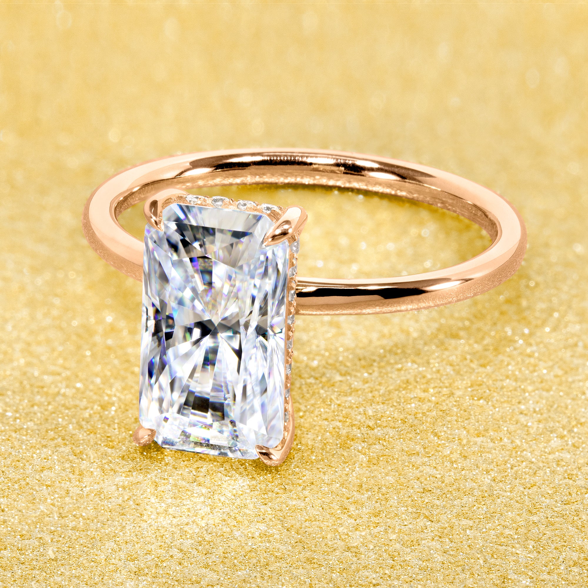 Classic Ariela 3ct Elongated Radiant-cut Moissanite Halo Solitaire Engagement ring complemented by Lab Diamonds handcrafted in 14K Gold, 18K Gold, or Platinum by Earthena Jewelry of Beverly Hills.