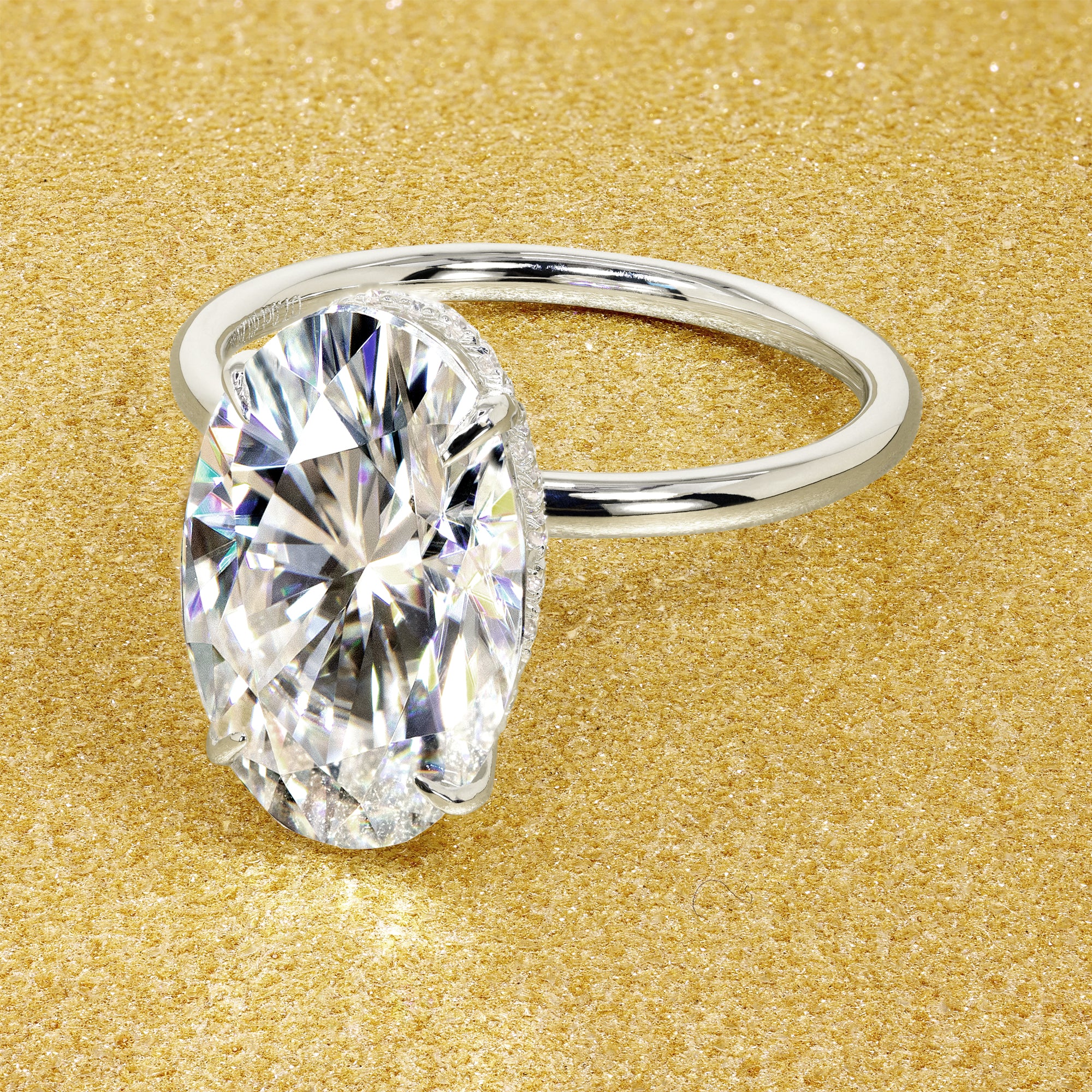 Classic Ariela 7ct Elongated Oval-cut Moissanite and Lab Diamond Hidden Halo Solitaire ring in 14K gold, 18K gold, or Platinum handcrafted in Los Angeles by Earthena Jewelry