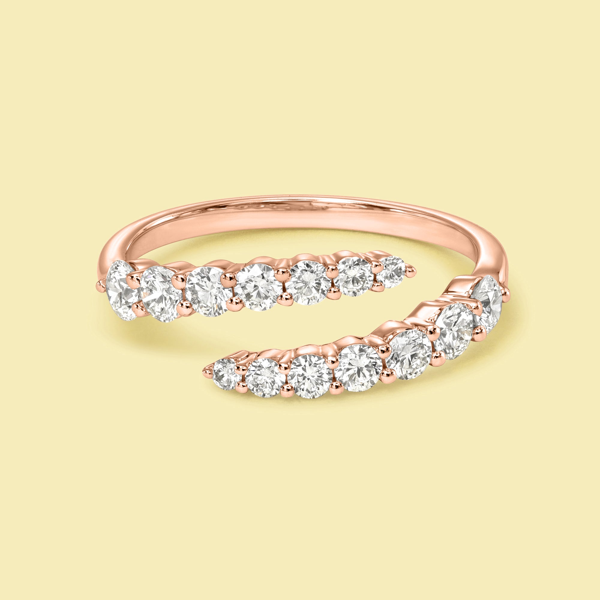 The Audrey, Graduated Bypass Diamond Wrap Band is handcrafted in 14K gold, 18K gold, or Platinum handcrafted by Earthena Jewelry of Beverly Hills.