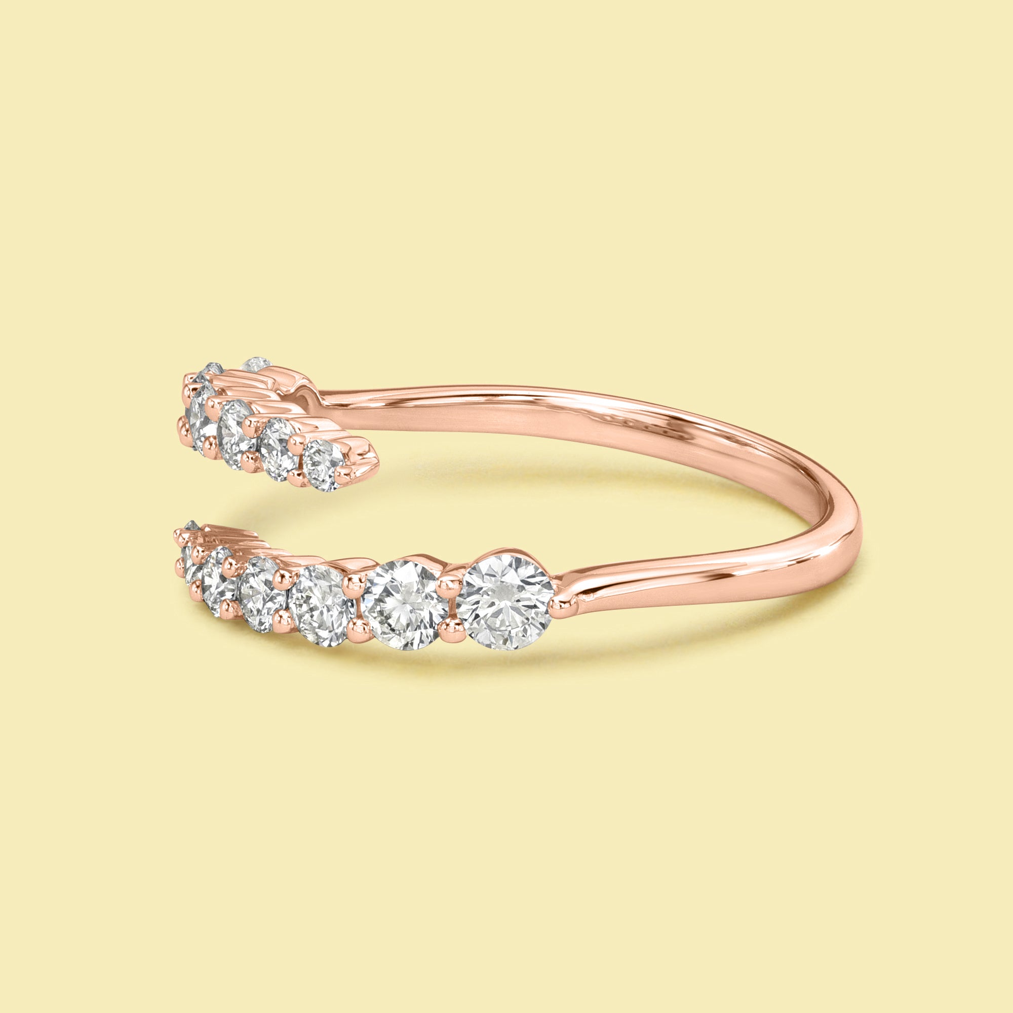 The Audrey, Graduated Bypass Diamond Wrap Band is handcrafted in 14K gold, 18K gold, or Platinum handcrafted by Earthena Jewelry of Beverly Hills.
