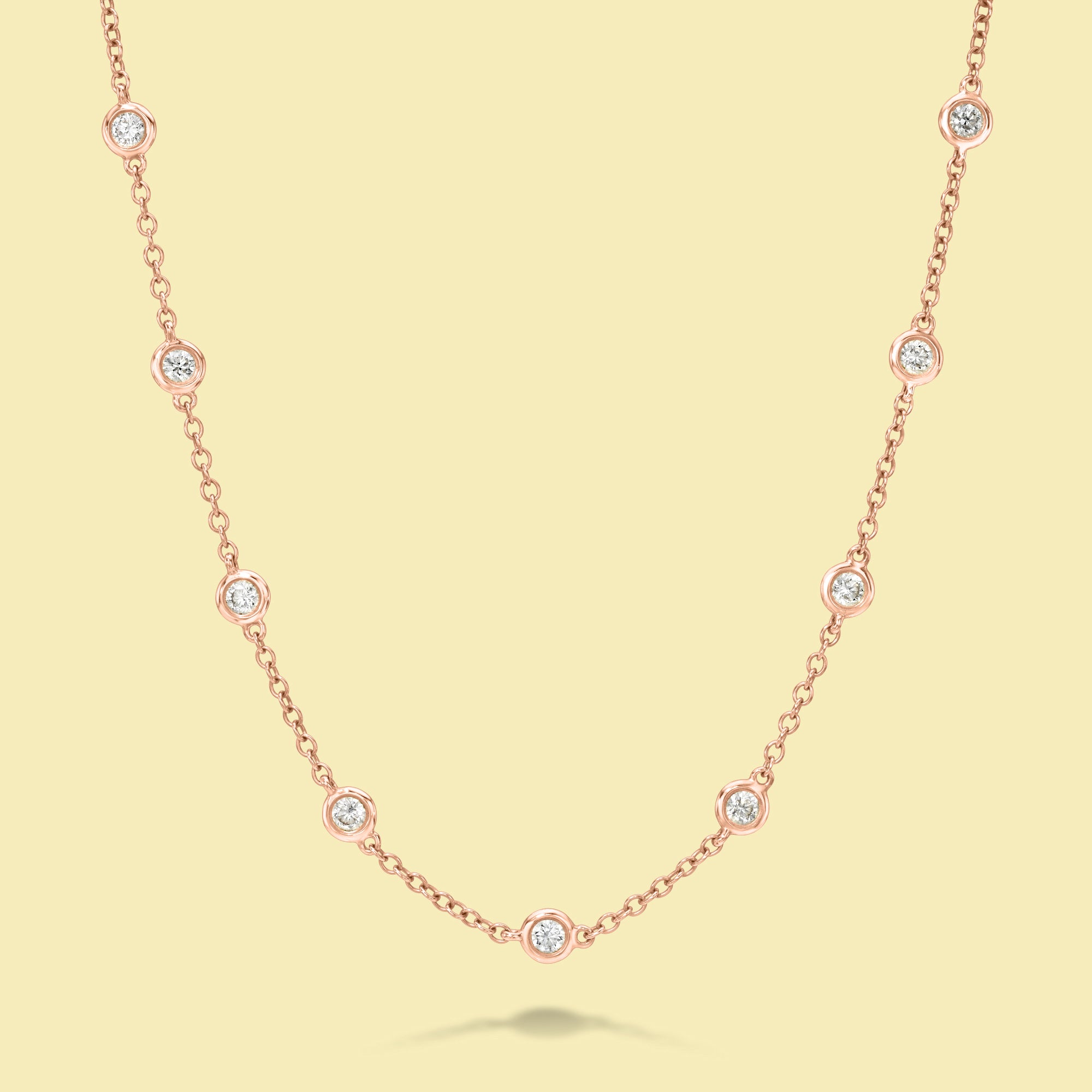 The Cloud, Classic Strand Bezel Diamond Necklace is handcrafted in 14K Gold, 18K Gold, or Platinum by Earthena Jewelry of Beverly Hills.