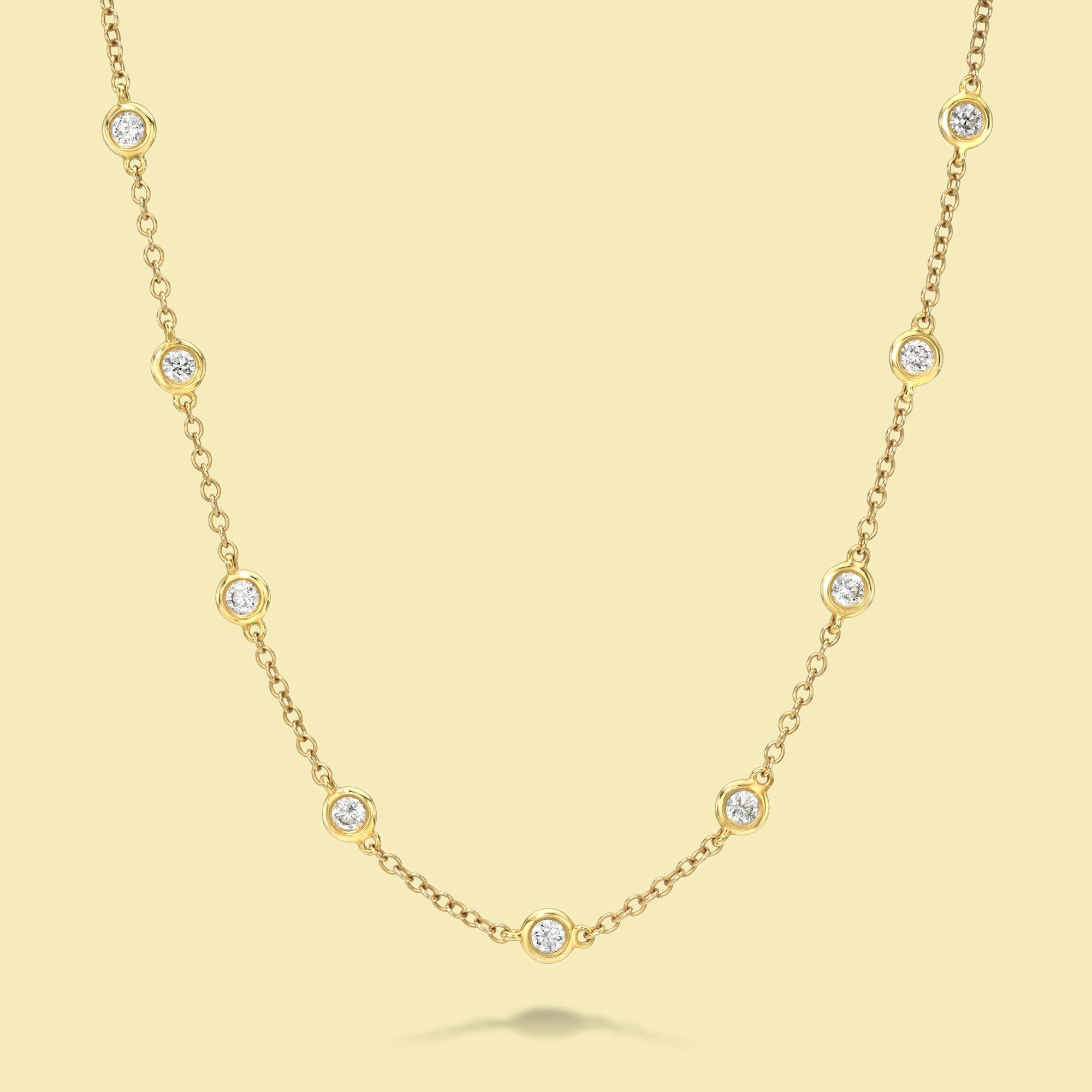 The Cloud, Classic Strand Bezel Diamond Necklace is handcrafted in 14K Gold, 18K Gold, or Platinum by Earthena Jewelry of Beverly Hills.