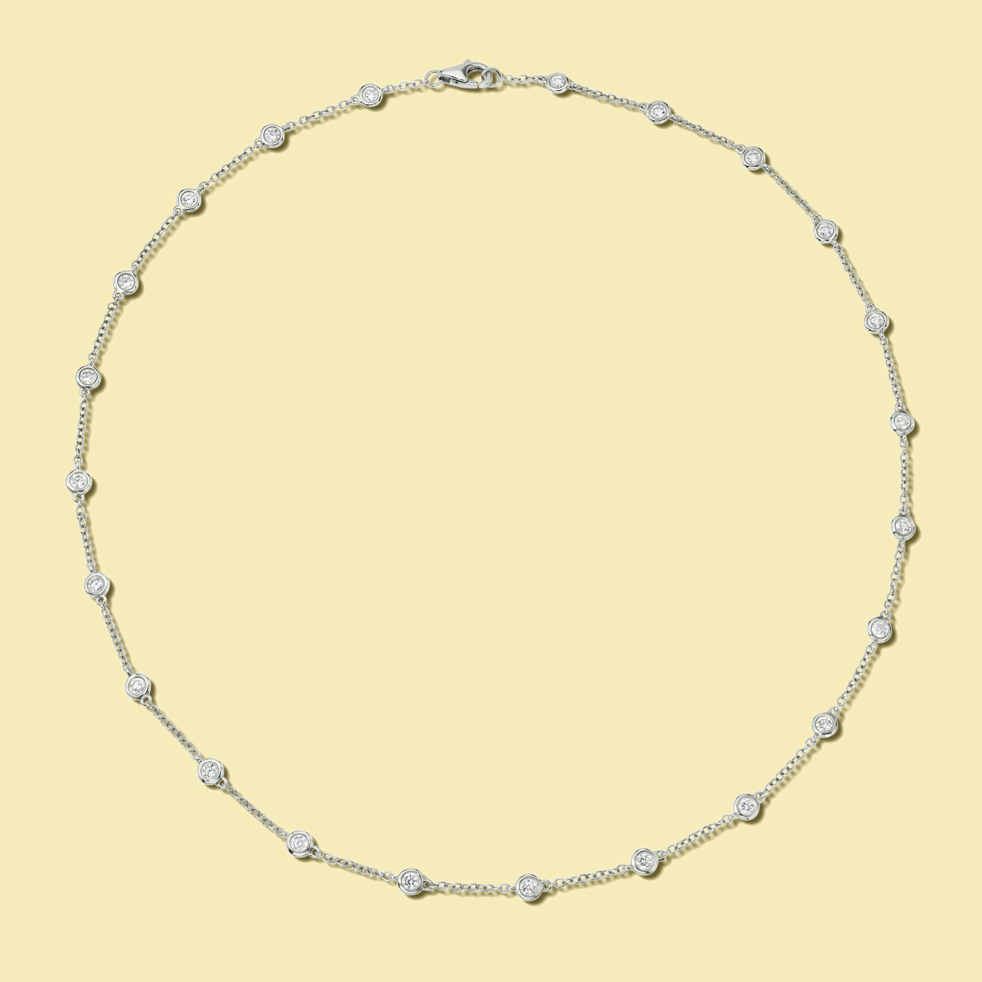 The Cloud, Classic Strand Bezel Diamond Necklace is handcrafted in 14K Gold, 18K Gold, or Platinum by Earthena Jewelry of Beverly Hills.