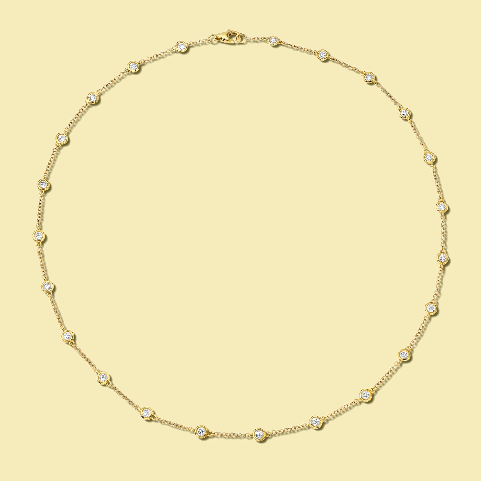 The Cloud, Classic Strand Bezel Diamond Necklace is handcrafted in 14K Gold, 18K Gold, or Platinum by Earthena Jewelry of Beverly Hills.