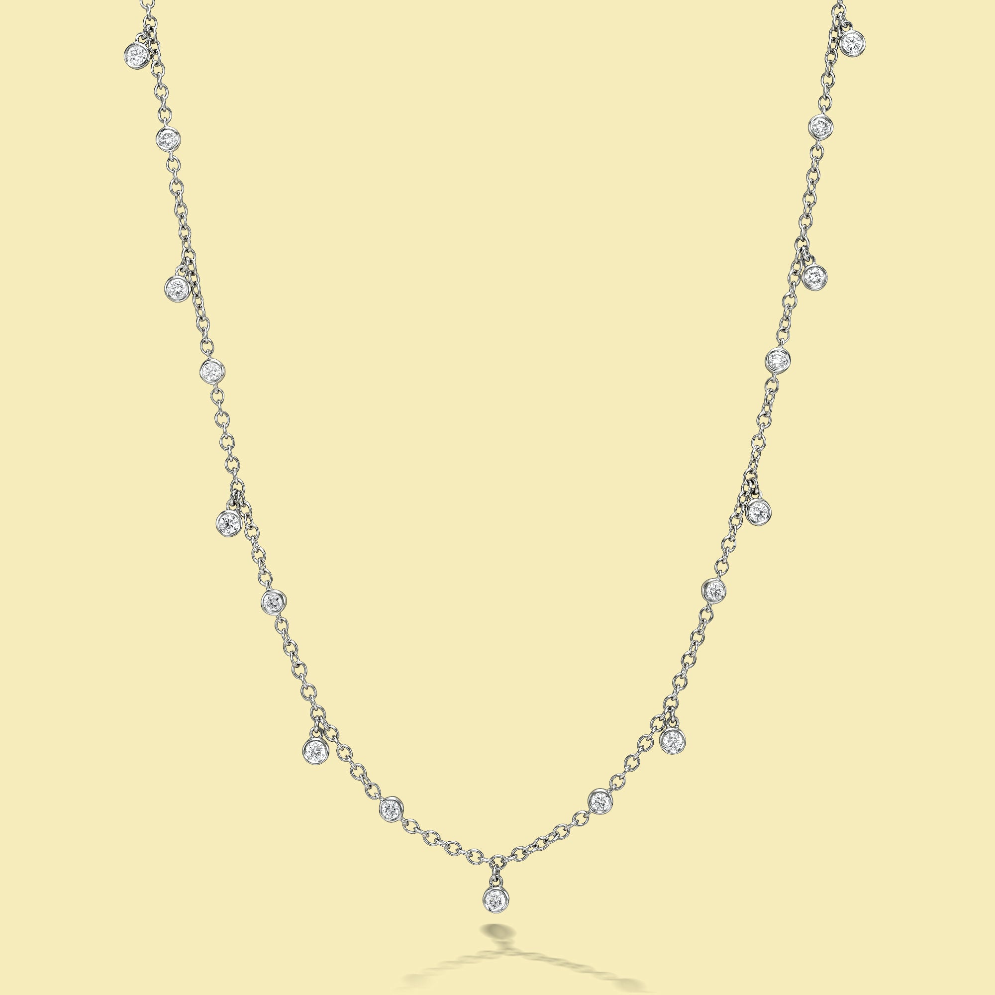 The Cloud, Dangle Strand Diamond Necklace is handcrafted in 14K Gold, 18K Gold, or Platinum by Earthena Jewelry of Beverly Hills.