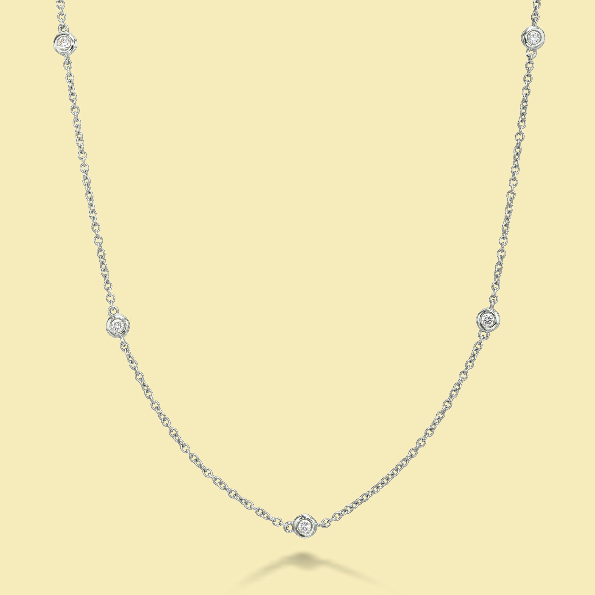 The Cloud, Classic Half-strand Bezel Diamond Necklace is handcrafted in 14K Gold, 18K Gold, or Platinum by Earthena Jewelry in Beverly Hills