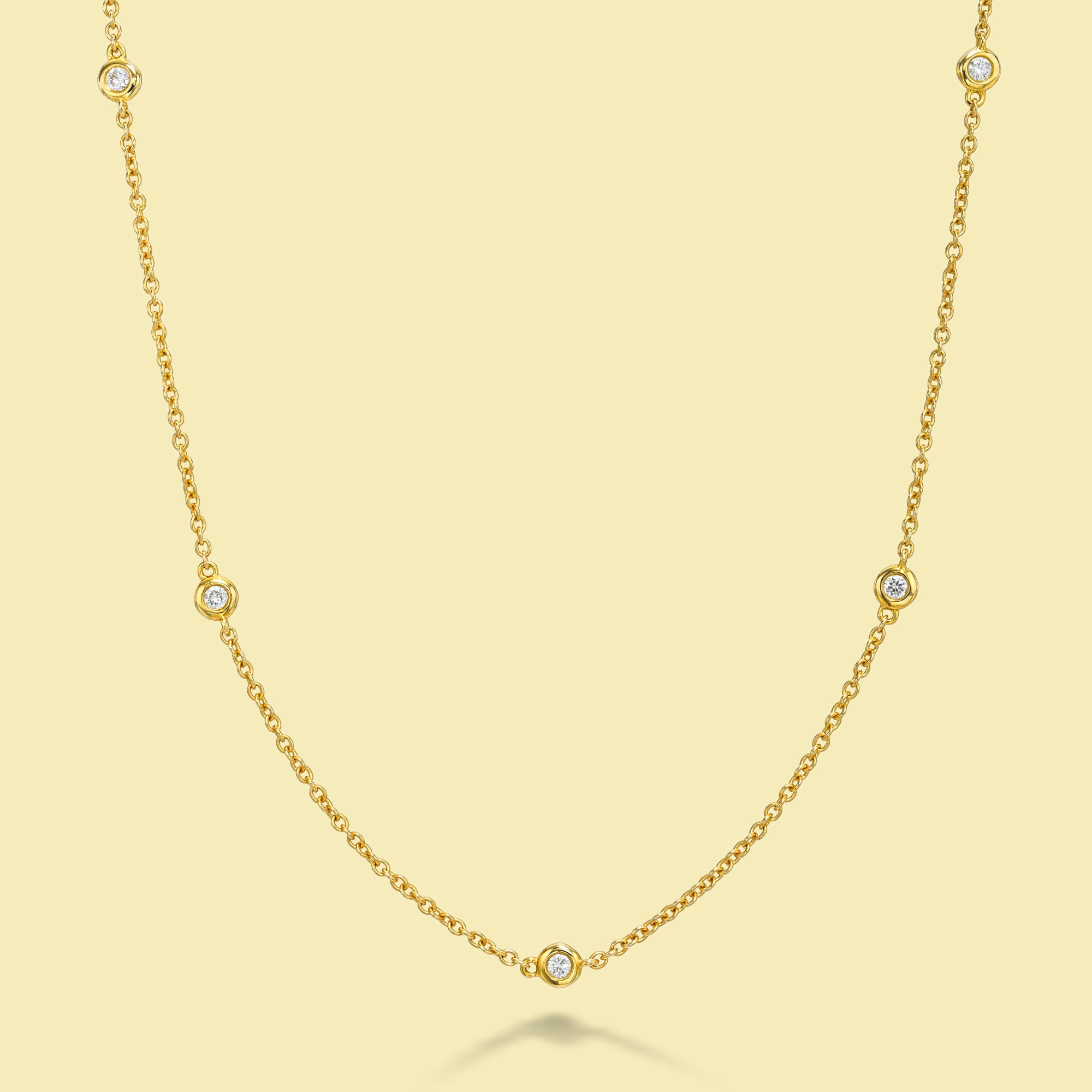 The Cloud, Classic Half-strand Bezel Diamond Necklace is handcrafted in 14K Gold, 18K Gold, or Platinum by Earthena Jewelry in Beverly Hills