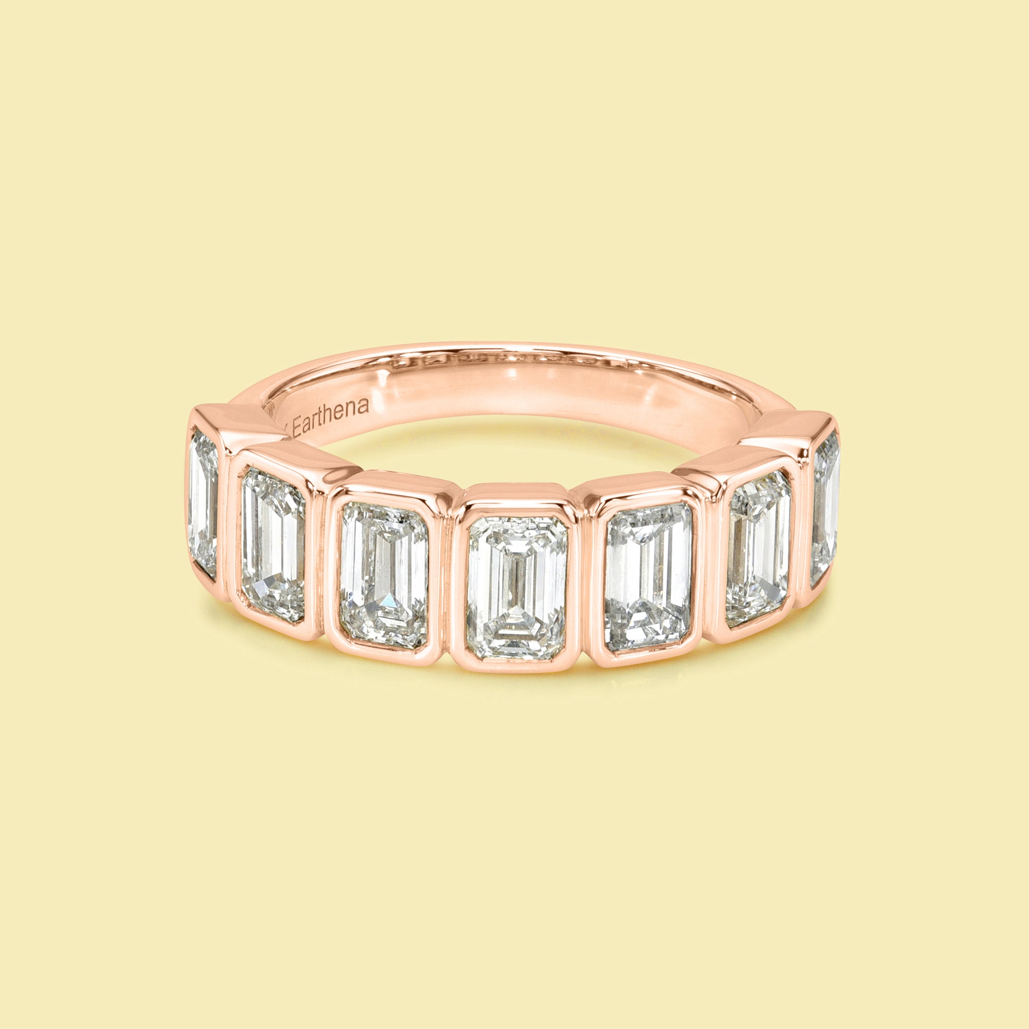 The Fiona Emerald cut Bezel Half Eternity lab-grown diamond Band handcrafted in 14K gold, 18K gold, and Platinum by Earthena Jewelry of Beverly Hills.
