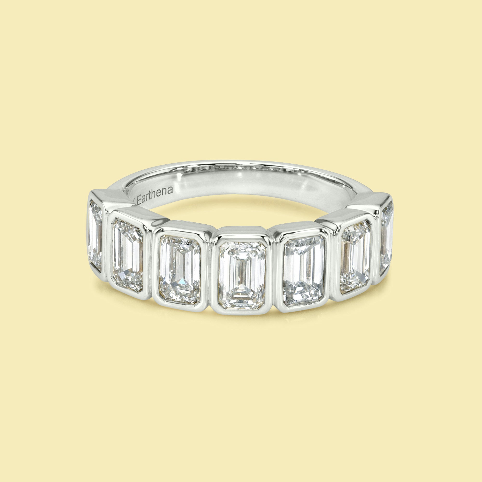 The Fiona Emerald cut Bezel Half Eternity lab-grown diamond Band handcrafted in 14K gold, 18K gold, and Platinum by Earthena Jewelry of Beverly Hills.
