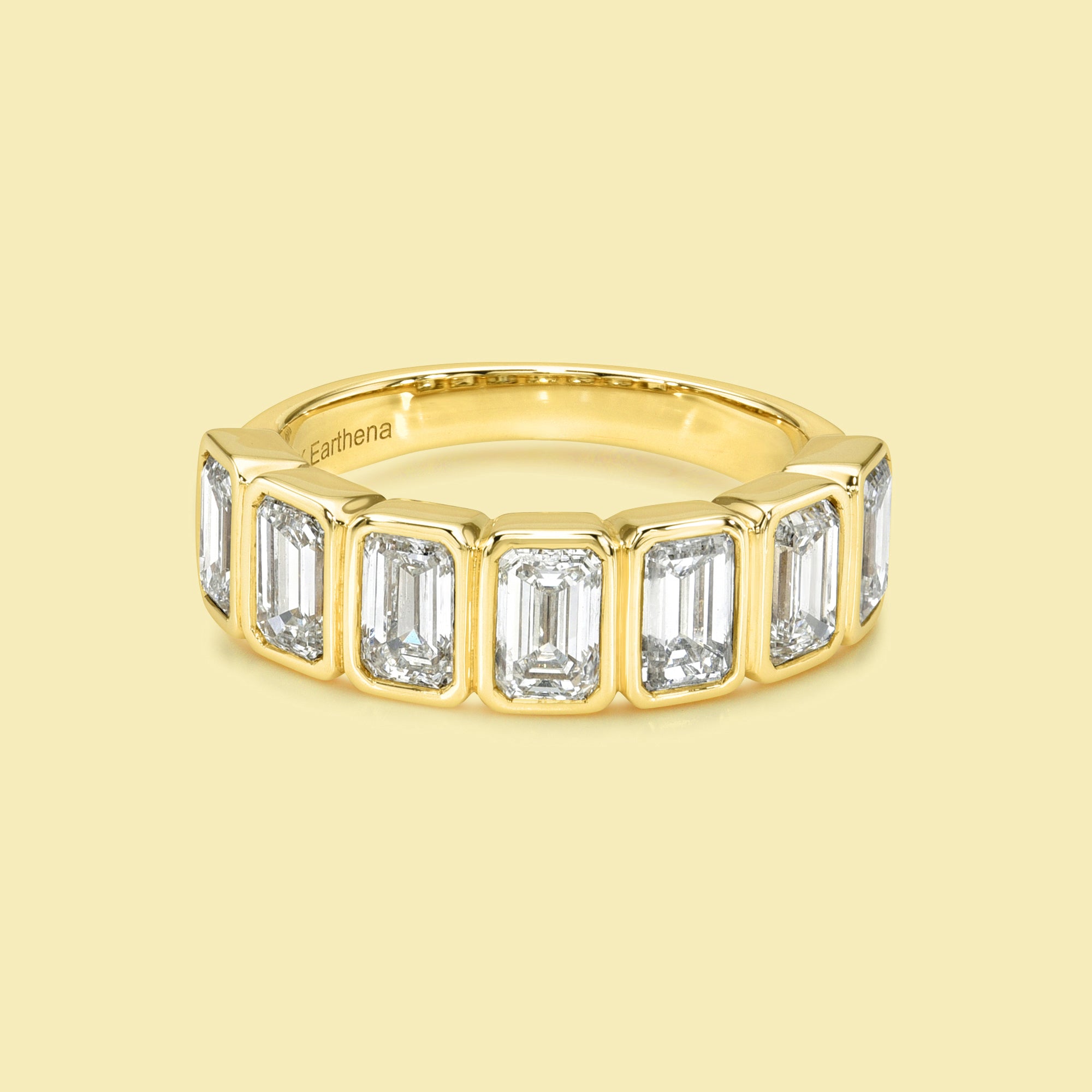 The Fiona Emerald cut Bezel Half Eternity lab-grown diamond Band handcrafted in 14K gold, 18K gold, and Platinum by Earthena Jewelry of Beverly Hills.
