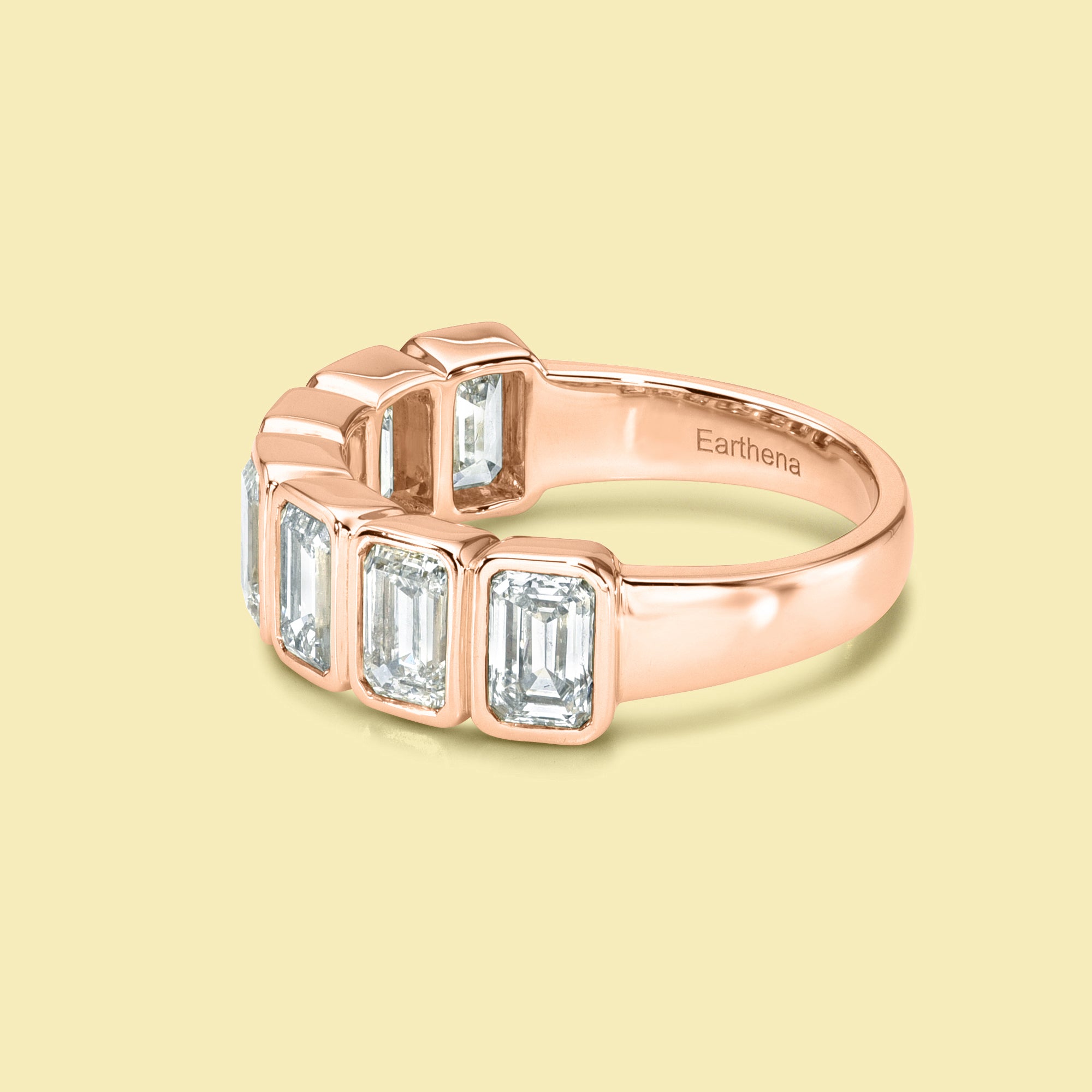 The Fiona Emerald cut Bezel Half Eternity lab-grown diamond Band handcrafted in 14K gold, 18K gold, and Platinum by Earthena Jewelry of Beverly Hills.