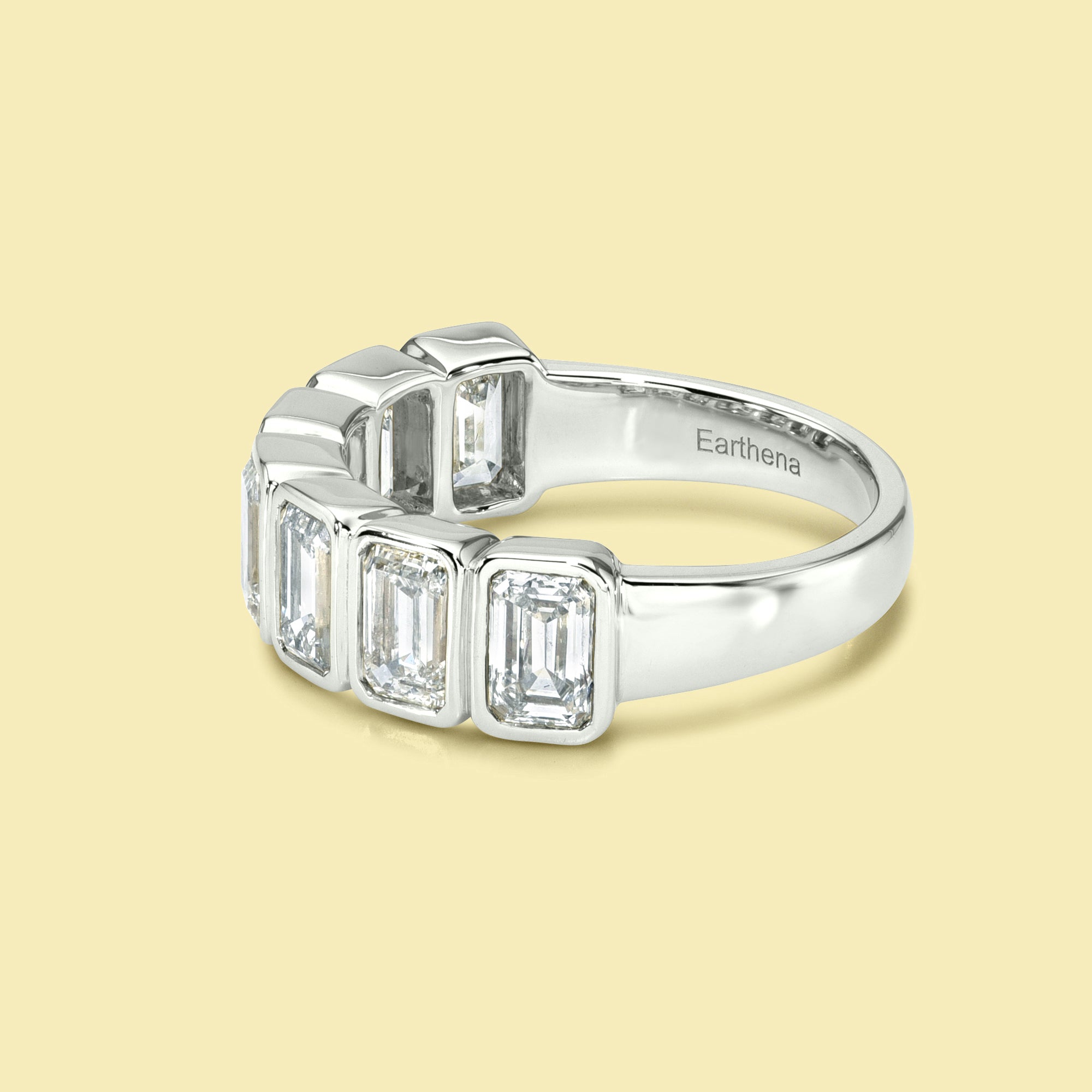 The Fiona Emerald cut Bezel Half Eternity lab-grown diamond Band handcrafted in 14K gold, 18K gold, and Platinum by Earthena Jewelry of Beverly Hills.