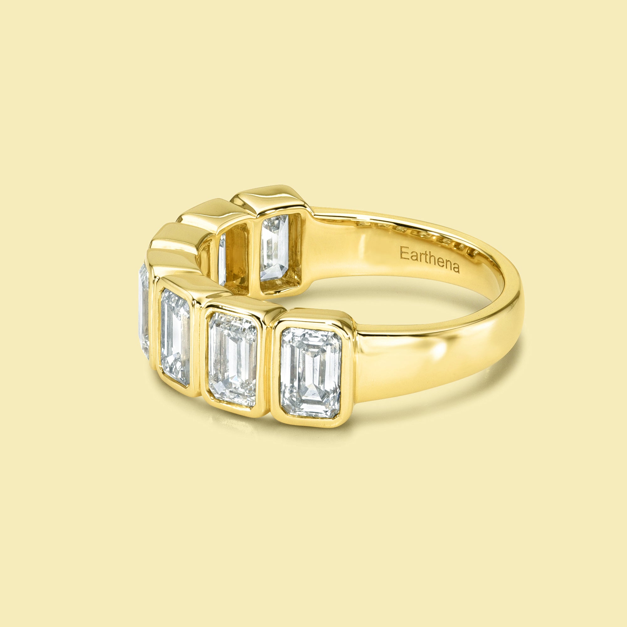 The Fiona Emerald cut Bezel Half Eternity lab-grown diamond Band handcrafted in 14K gold, 18K gold, and Platinum by Earthena Jewelry of Beverly Hills.