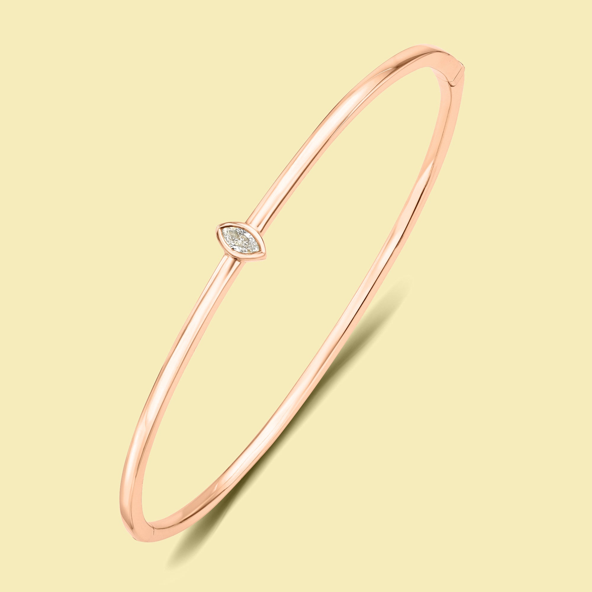 The Fiona, Marquise-cut Lab-grown and Natural diamond Bezel Solitaire Bangle handcrafted 14K gold, 18K gold and Platinum by Earthena Jewelry of Beverly Hills.