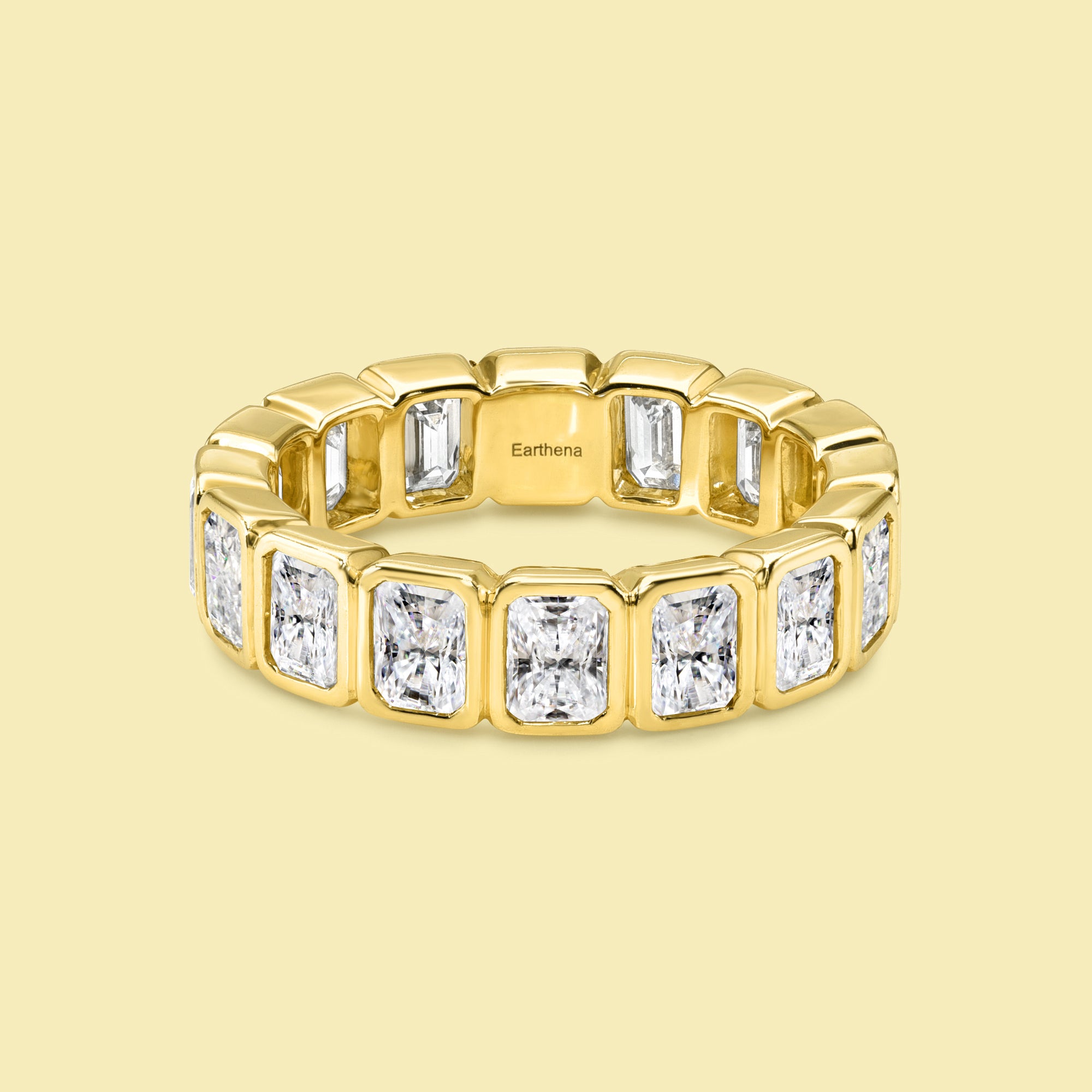 The Fiona Radiant-cut Diamond Bezel Eternity Band is handcrafted in 14K gold, 18K gold, and Platinum handcrafted in Los Angeles by Earthena Jewelry of Beverly Hills.