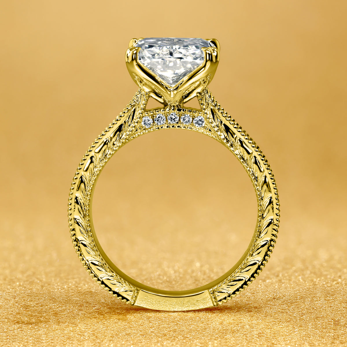 The Elizabeth, 4ct Elongated Radiant-Cut Lab-Grown Diamond Engraved 4-Prong Tulip Engagement Ring in 14K Gold, 18K Gold, or Platinum by Earthena Jewelry of Beverly Hills.