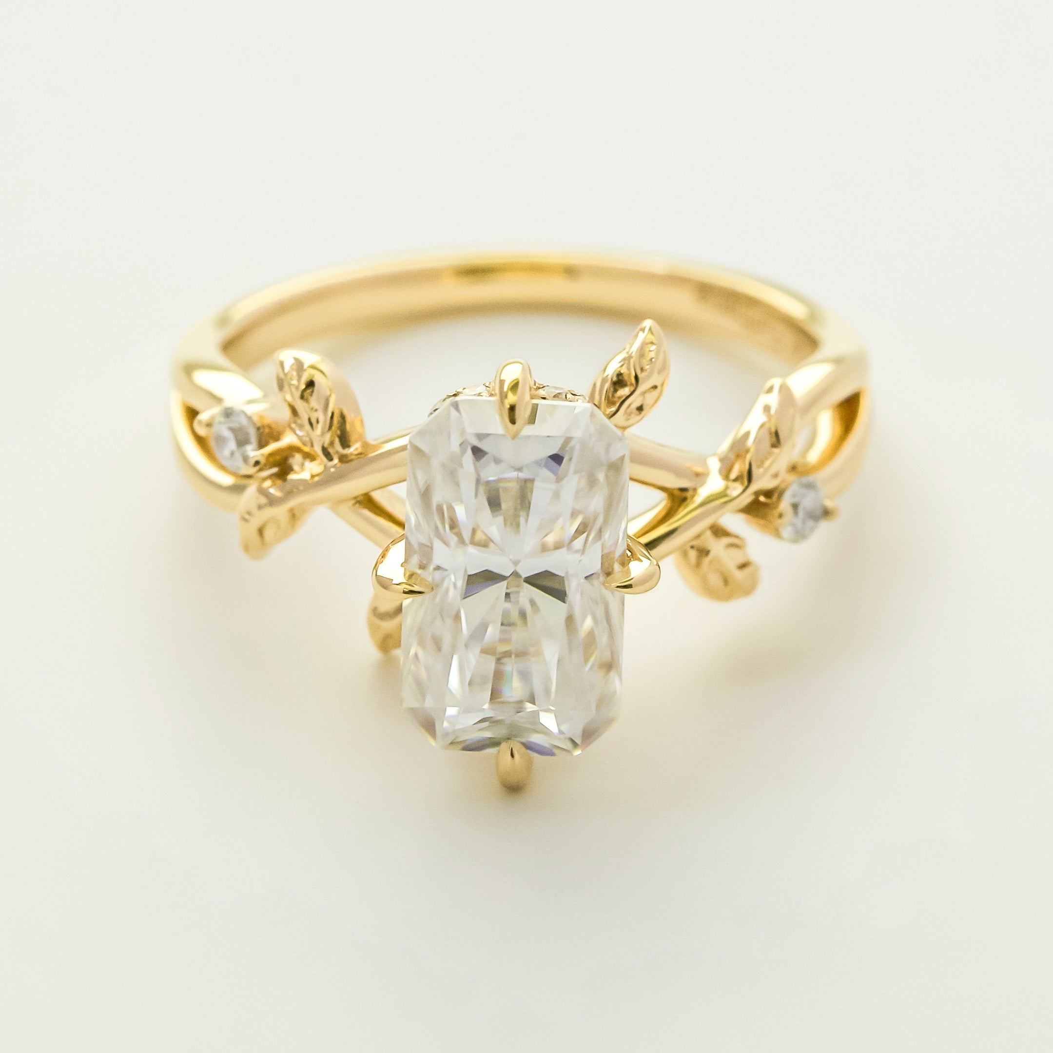 Flora 3ct Elongated Radiant-cut Moissanite Compass Hidden Halo Floral Lab-grown Diamond Engagement ring in 14K gold, 18K gold, or Platinum by Earthena Jewelry of Beverly Hills.