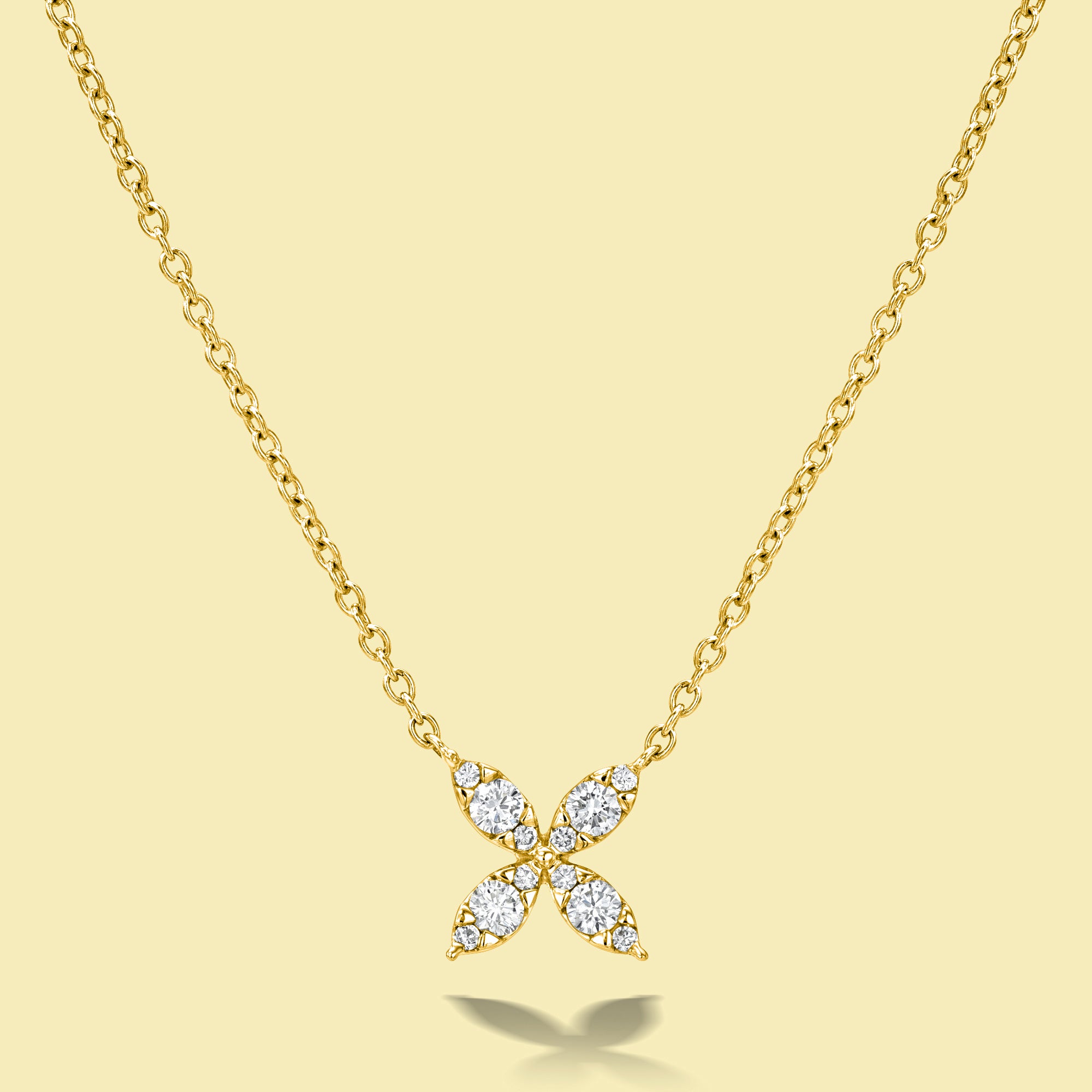 The Flora, Classic Four Petal Diamond Necklace is handcrafted in 14K Gold, 18K Gold, or Platinum by Earthena Jewelry in Los Angeles