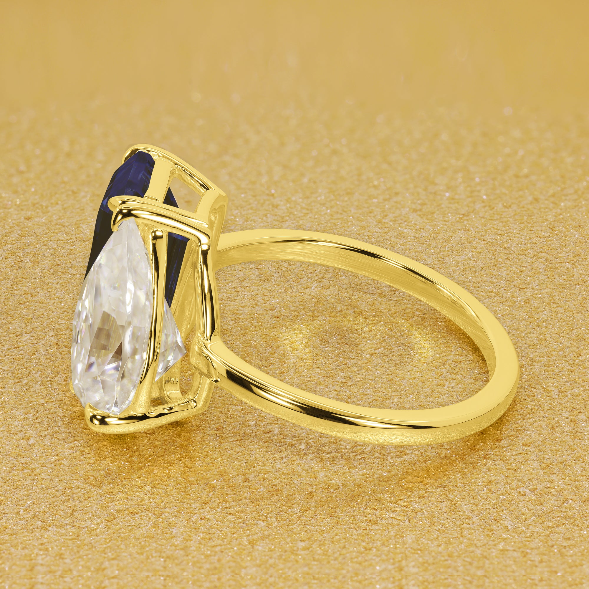 This timeless "Toi et Moi" Gemini Sleek engagement ring showcases a captivating combination of a 3.75ct lab-grown elongated emerald-cut blue sapphire and a 2.25ct pear-shaped moissanite in a minimalistic plain gold band setting. The ring is available in 14K Gold, 18K Gold, or Platinum by Earthena Jewelry of Beverly HIlls.