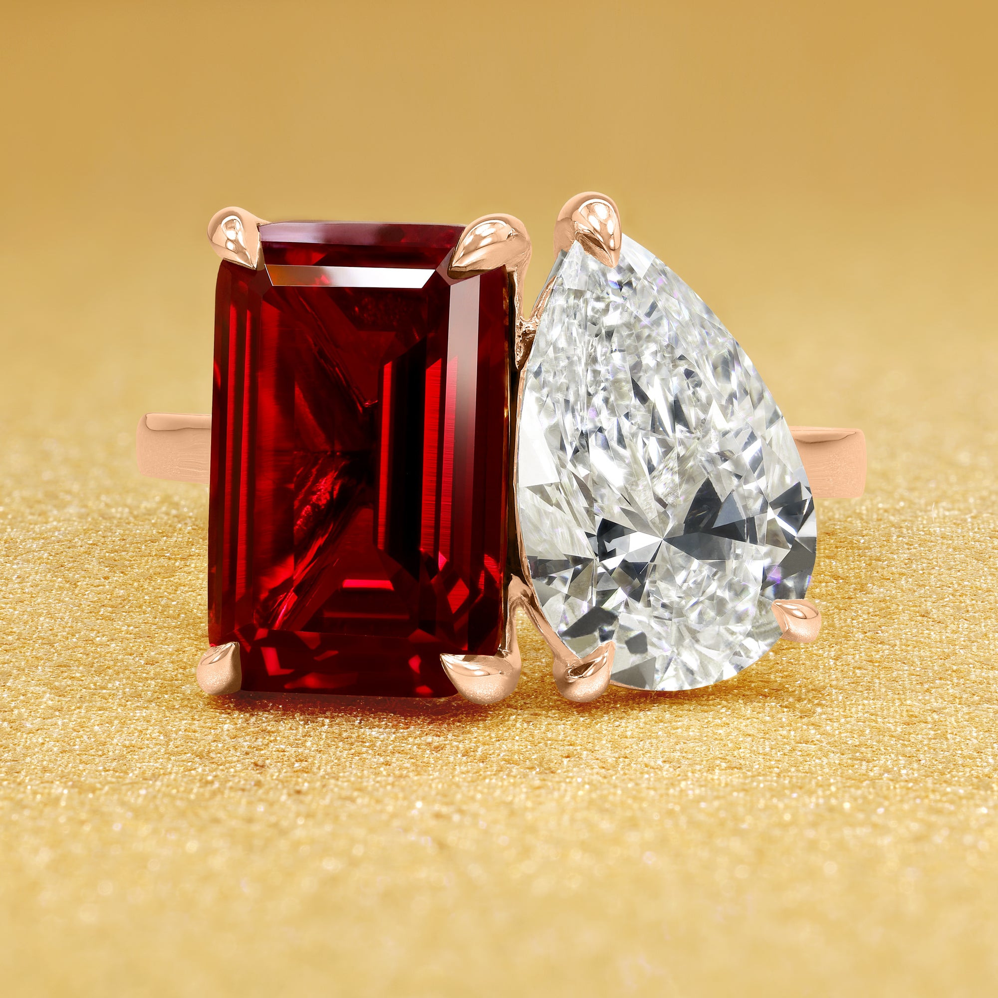 This timeless "Toi et Moi" Gemini Sleek cathedral engagement ring showcases a captivating combination of a 3.75ct lab-grown elongated emerald-cut ruby and a lab-grown 2ct pear-shaped diamond in a minimalistic plain gold band setting. The ring is available in 14K Gold, 18K Gold, or Platinum by Earthena Jewelry of Beverly Hills.
