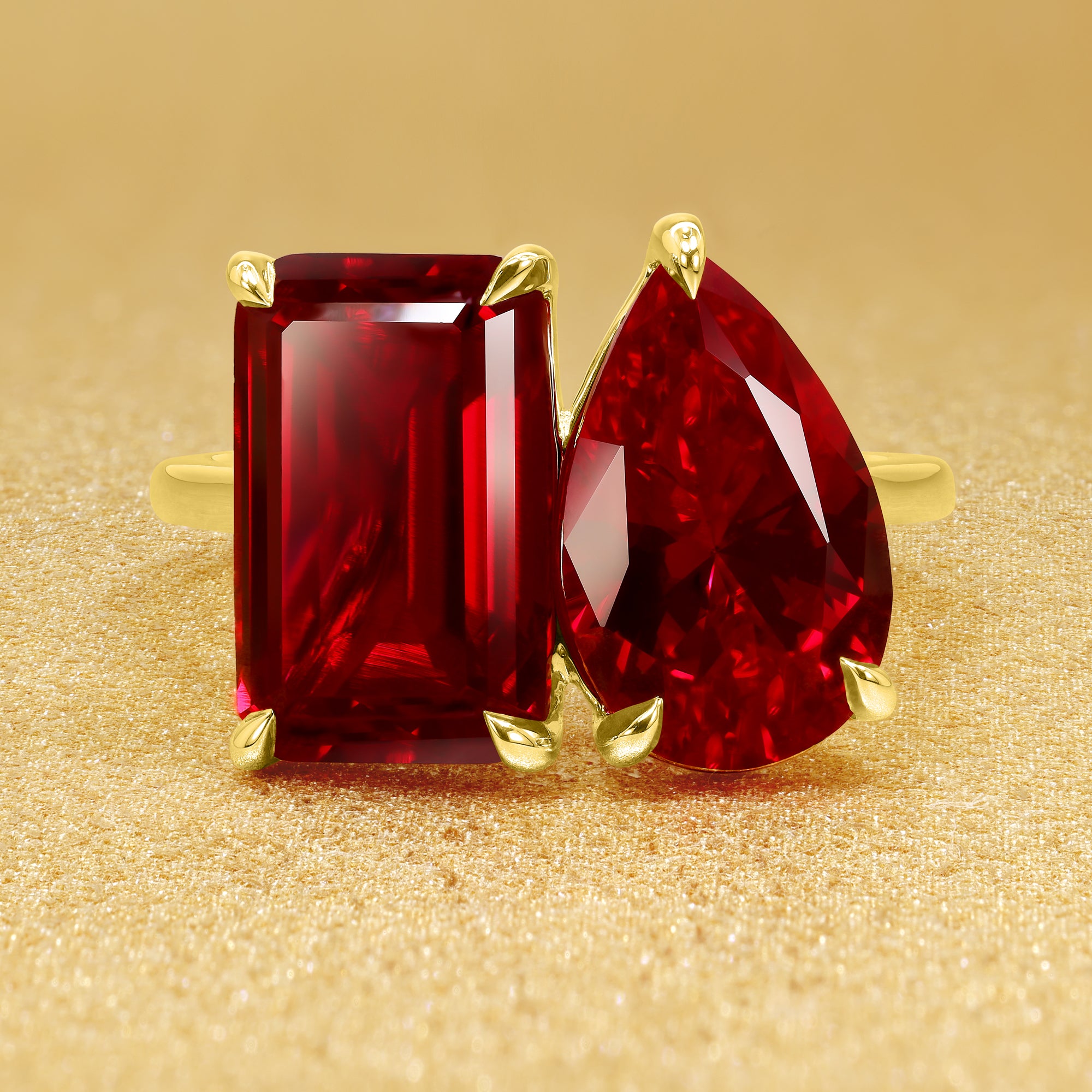 The Gemini Sleek Cathedral, Toi et Moi 6 ctw Lab-grown Emerald-cut Ruby and Pear-shaped Ring in 14K Gold, 18K Gold, or Platinum by Earthena Jewelry of Beverly Hills, Califorina.