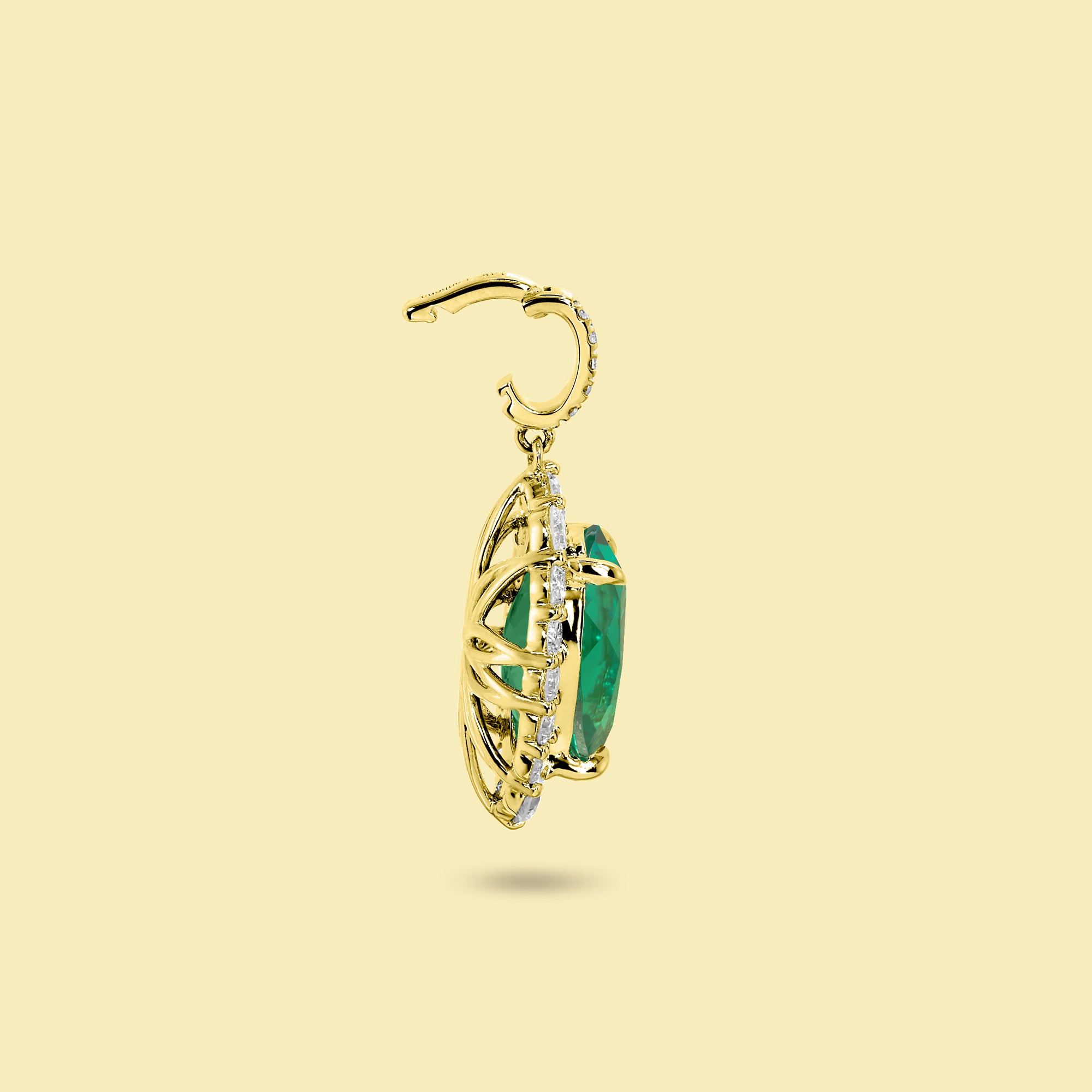 Gloria 3ct Oval-Cut Colombian Green Lab-Grown Emerald Halo Charm Pendant in 14K Gold, 18K Gold, or Platinum by Earthena Jewelry of Beverly Hills.