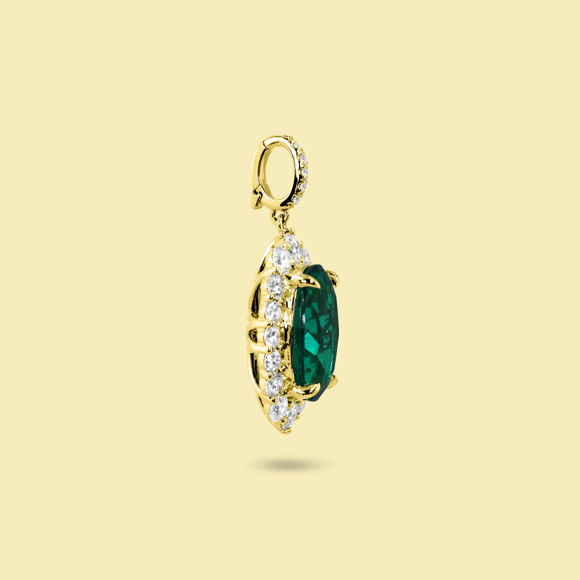 Gloria 3ct Oval-Cut Zambian Green Lab-Grown Emerald Halo Charm Pendant in 14K Gold, 18K Gold, or Platinum by Earthena Jewelry of Beverly Hills.