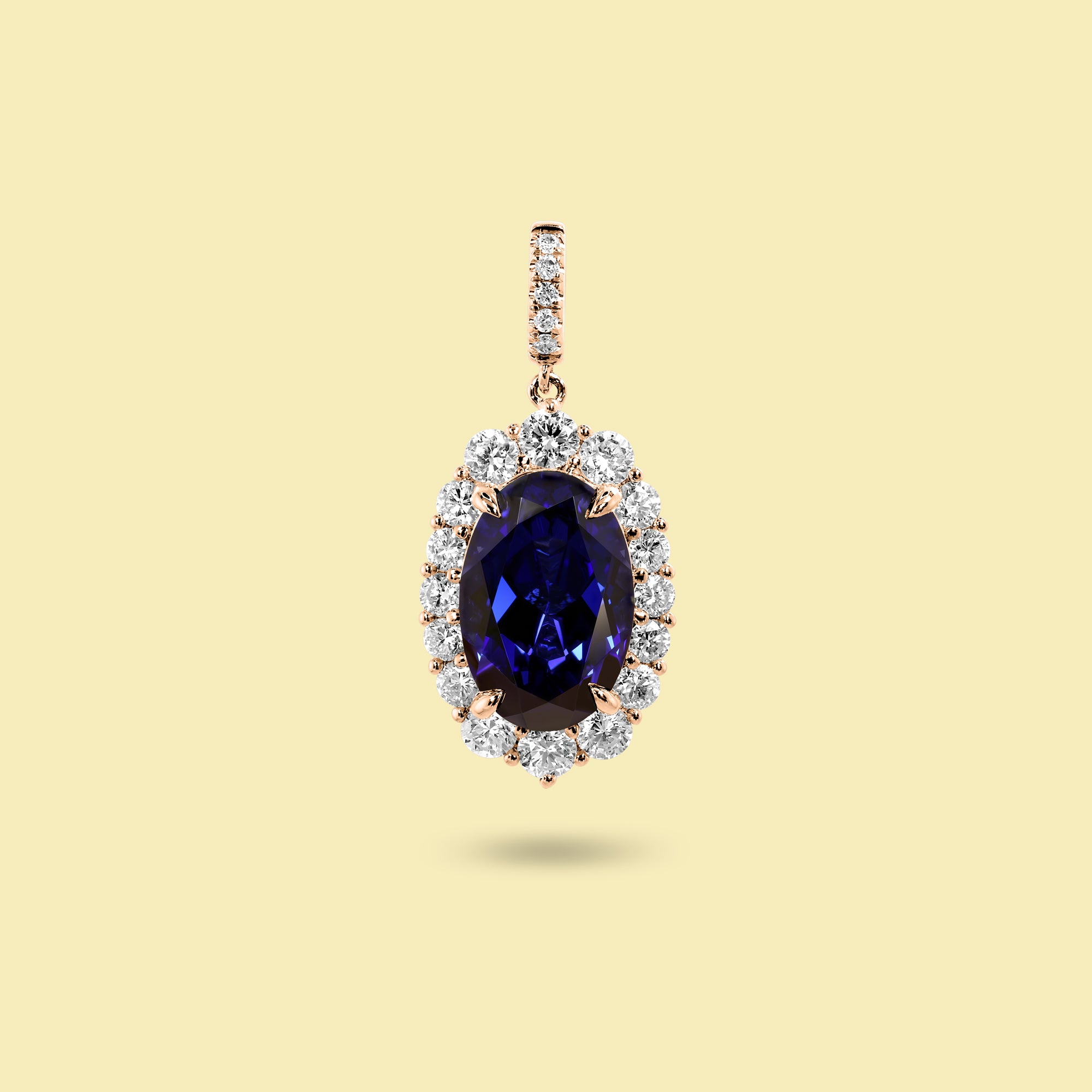 Gloria 4ct Elongated Lab-Grown Oval-Cut Blue Sapphire Halo Charm Pendant in 14K Gold, 18K Gold, or Platinum by Earthena Jewelry of Beverly Hills.