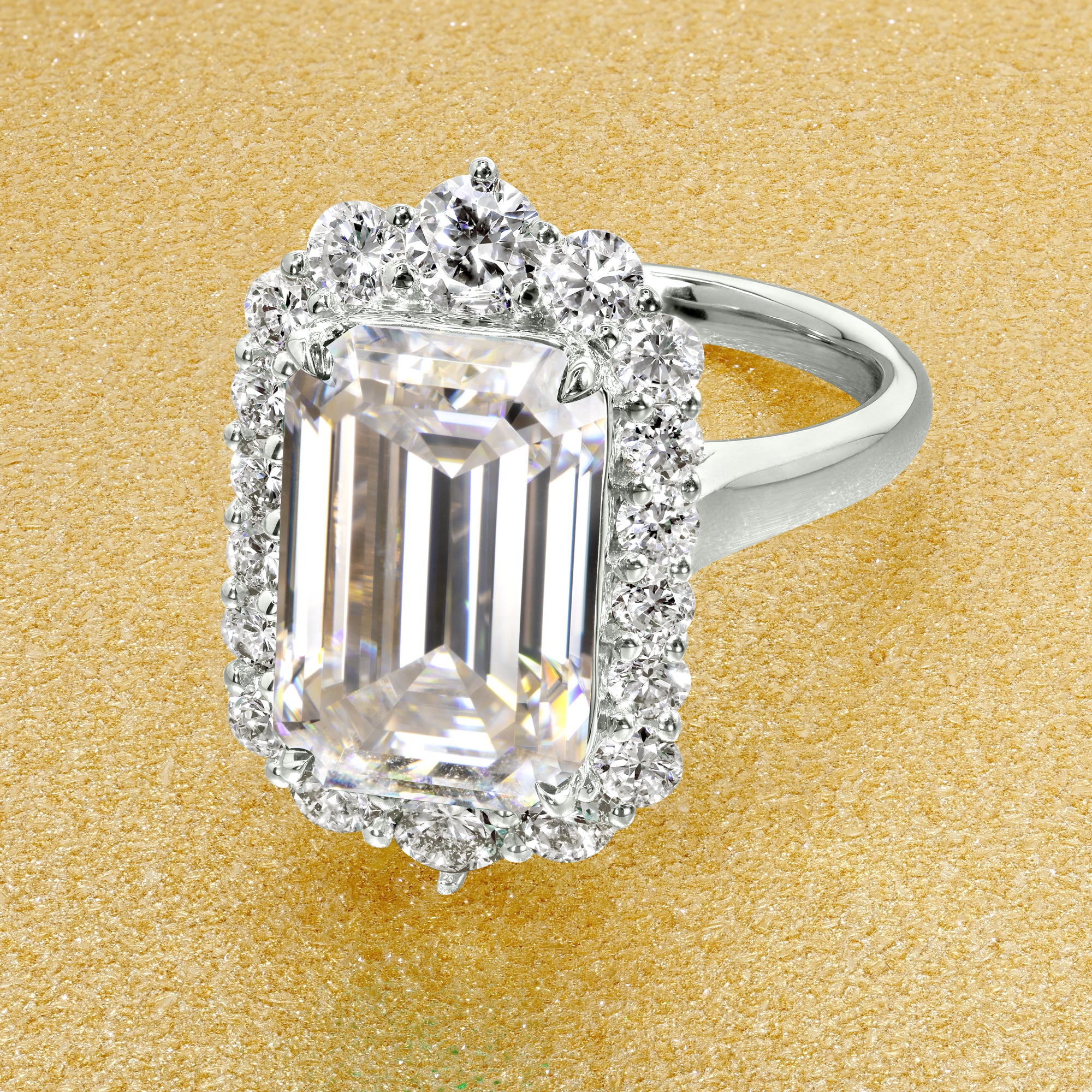 Gloria 5.5ct Elongated Emerald-Cut Moissanite Halo Cathedral Engagement Ring in 14K Gold, 18K Gold, or Platinum by Earthena Jewelry of Beverly Hills.