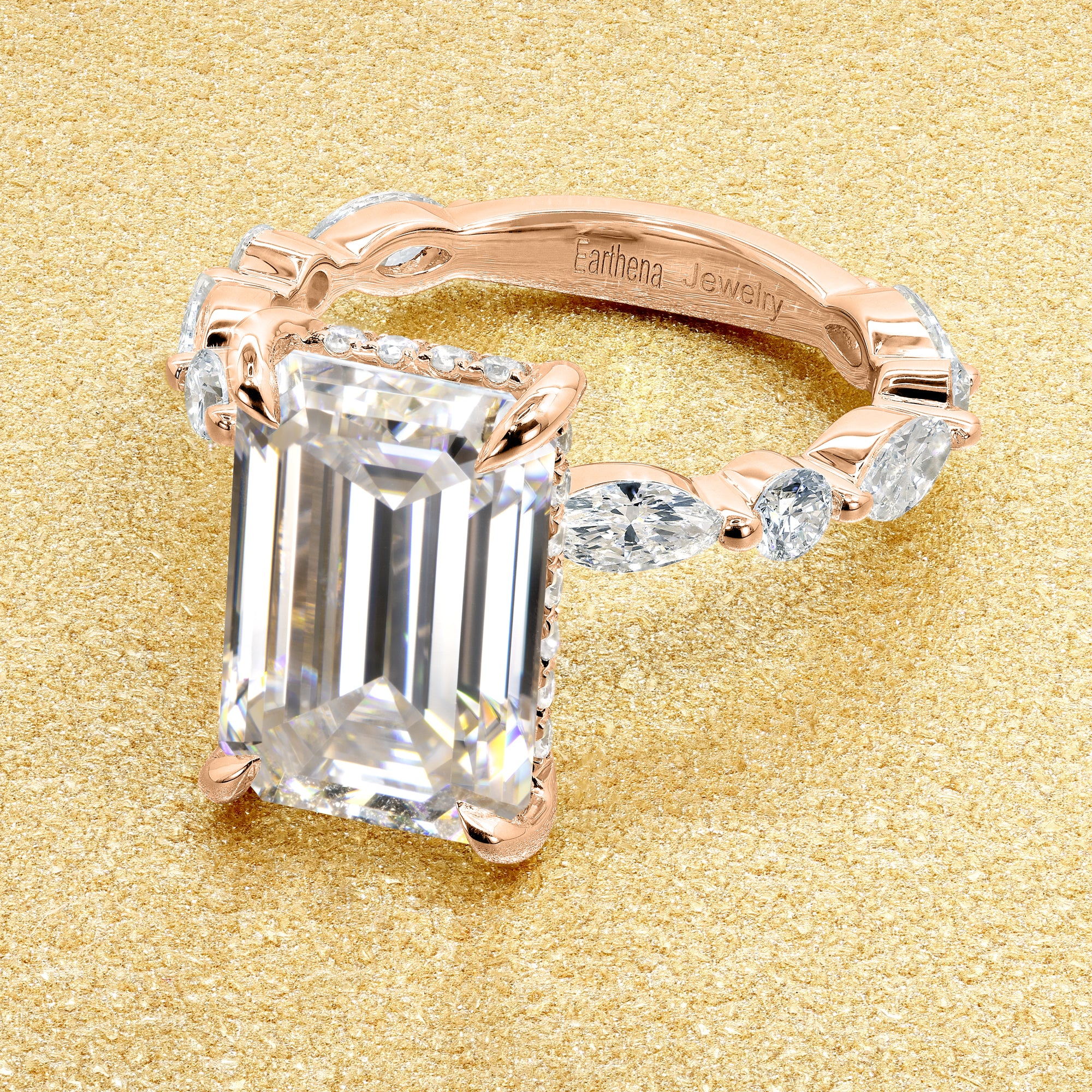 Classic Grace 5.5ct Emerald-cut Moissanite Hidden Halo Floating Marquise and Round Lab-grown Diamond Engagement ring in 14K Gold, 18K Gold, or Platinum by Earthena Jewelry of Beverly Hills.