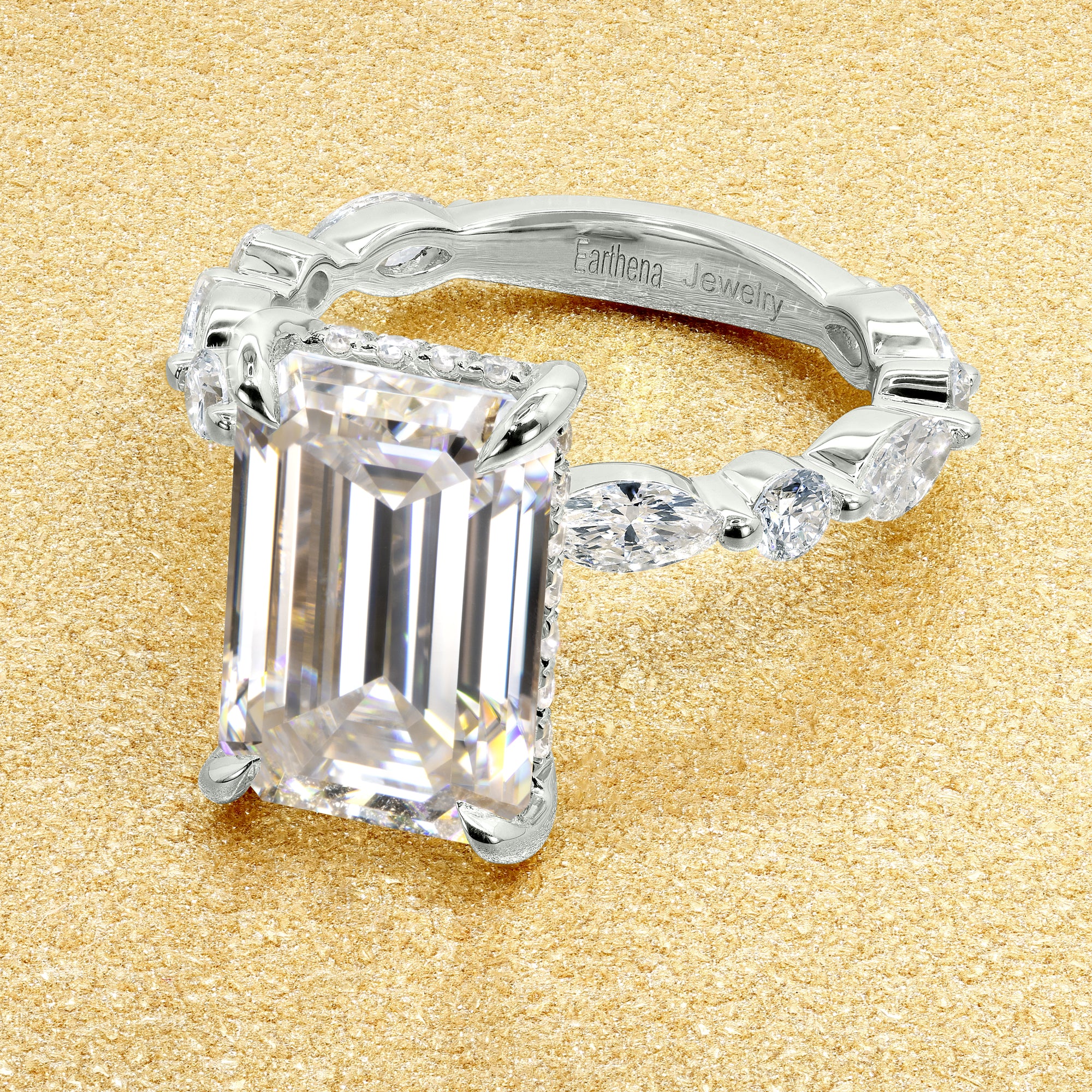 Classic Grace 5.5ct Emerald-cut Moissanite Hidden Halo Floating Marquise and Round Lab-grown Diamond Engagement ring in 14K Gold, 18K Gold, or Platinum by Earthena Jewelry of Beverly Hills.