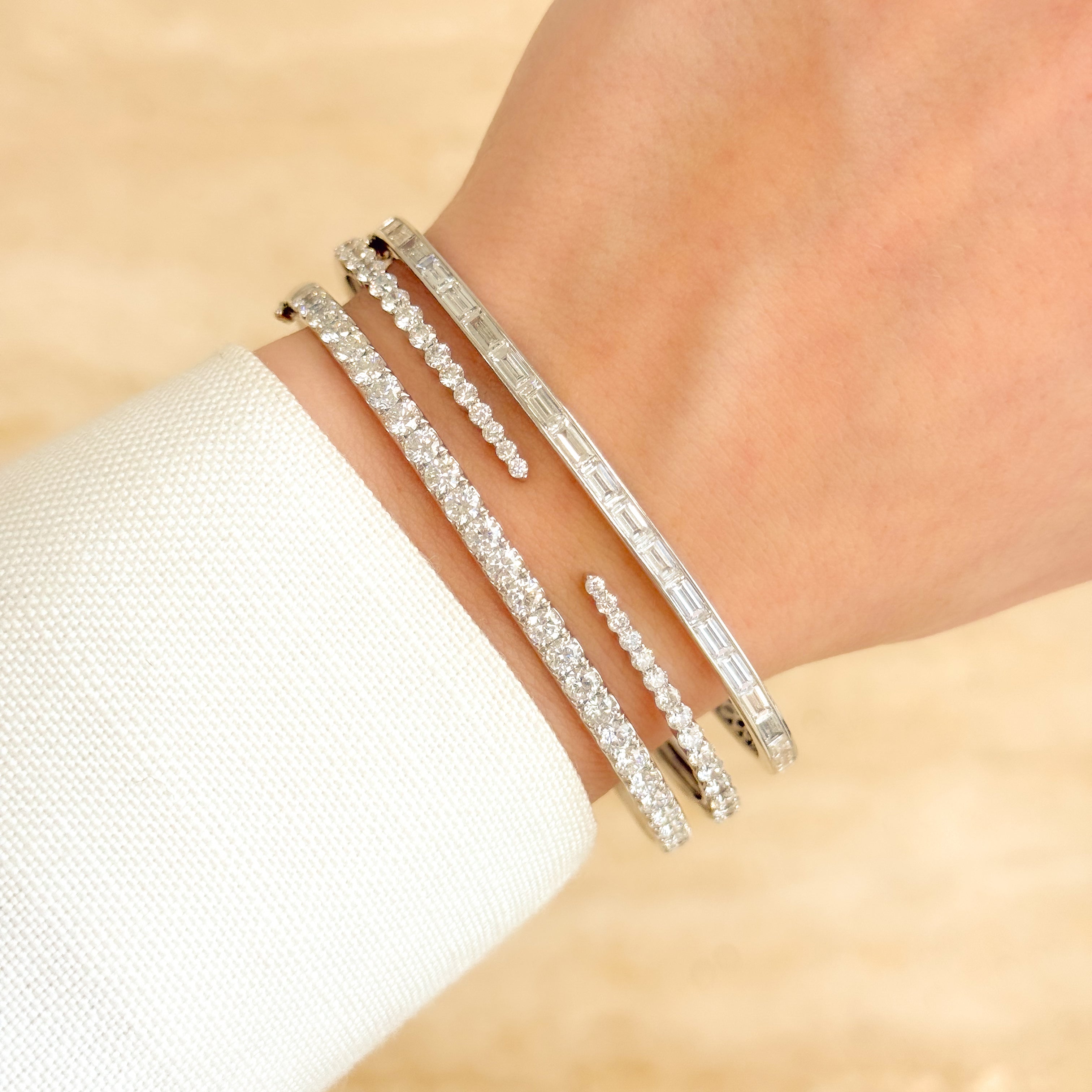 The Zoe, Classic Baguette Diamond Bangle is handcrafted in 14K gold, 18K gold, or Platinum by Earthena Jewelry of Beverly Hills in California.