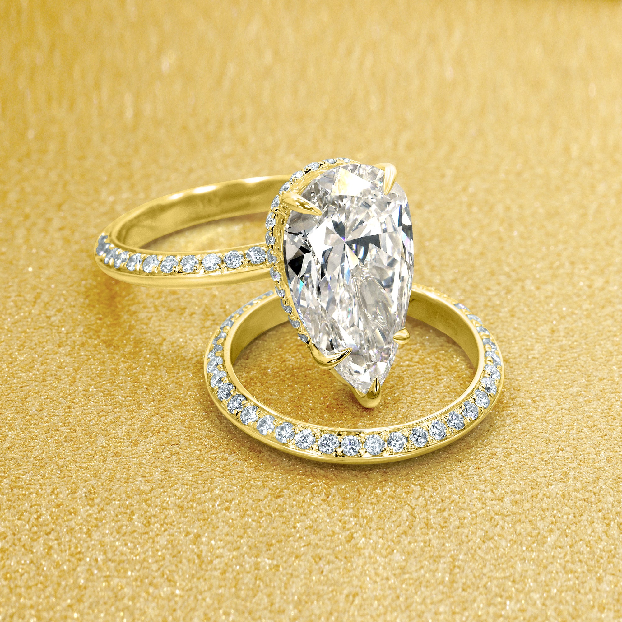 Axis 5ct Pear-Shaped Lab-Grown Diamond Knife-Edge Engagement Ring in 14K Gold, 18K Gold, or Platinum by Earthena Jewelry of Beverly Hills.