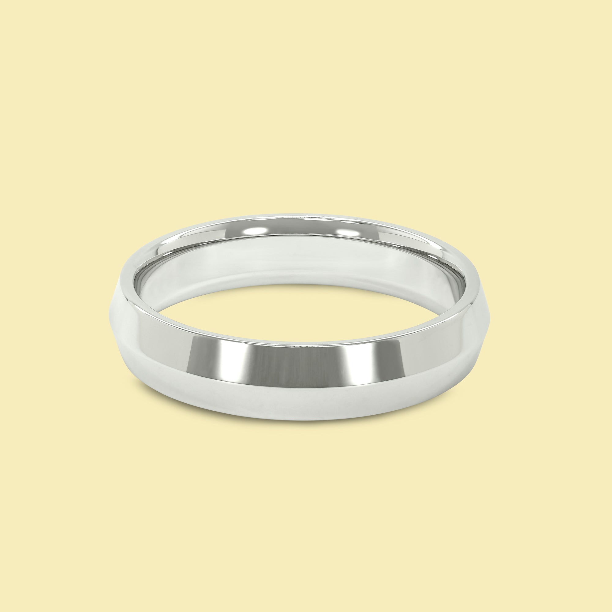 The Jett Solid Gold 5mm Knife Edge High Polish Comfort Fit Men's Wedding Band in 14K Gold, 18K Gold, or Platinum by Earthena Jewelry of Beverly Hills.