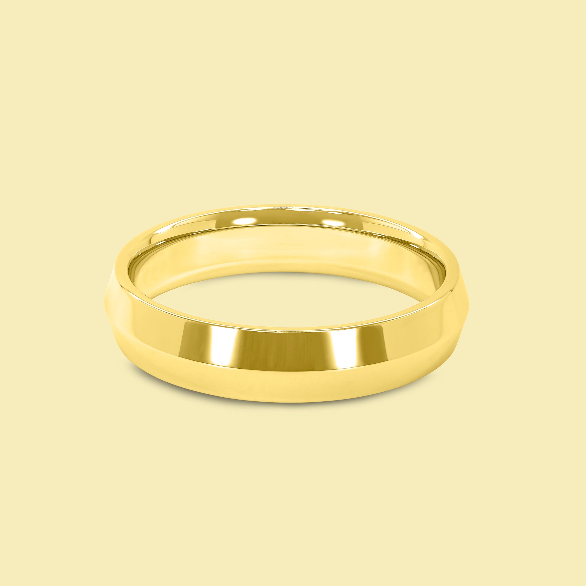 The Jett Solid Gold 5mm Knife Edge High Polish Comfort Fit Men's Wedding Band in 14K Gold, 18K Gold, or Platinum by Earthena Jewelry of Beverly Hills.