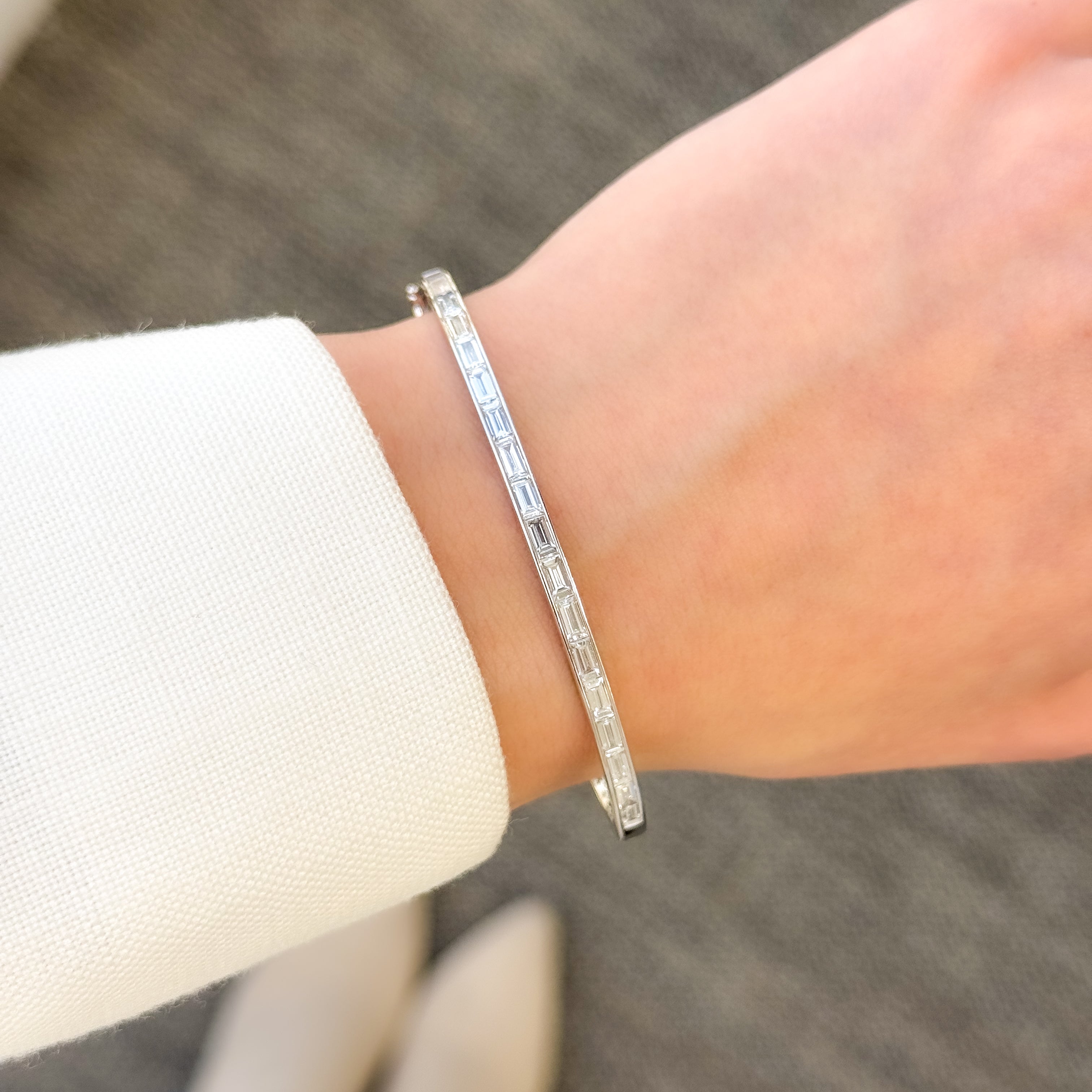 The Zoe, Classic Baguette Diamond Bangle is handcrafted in 14K gold, 18K gold, or Platinum by Earthena Jewelry of Beverly Hills in California.