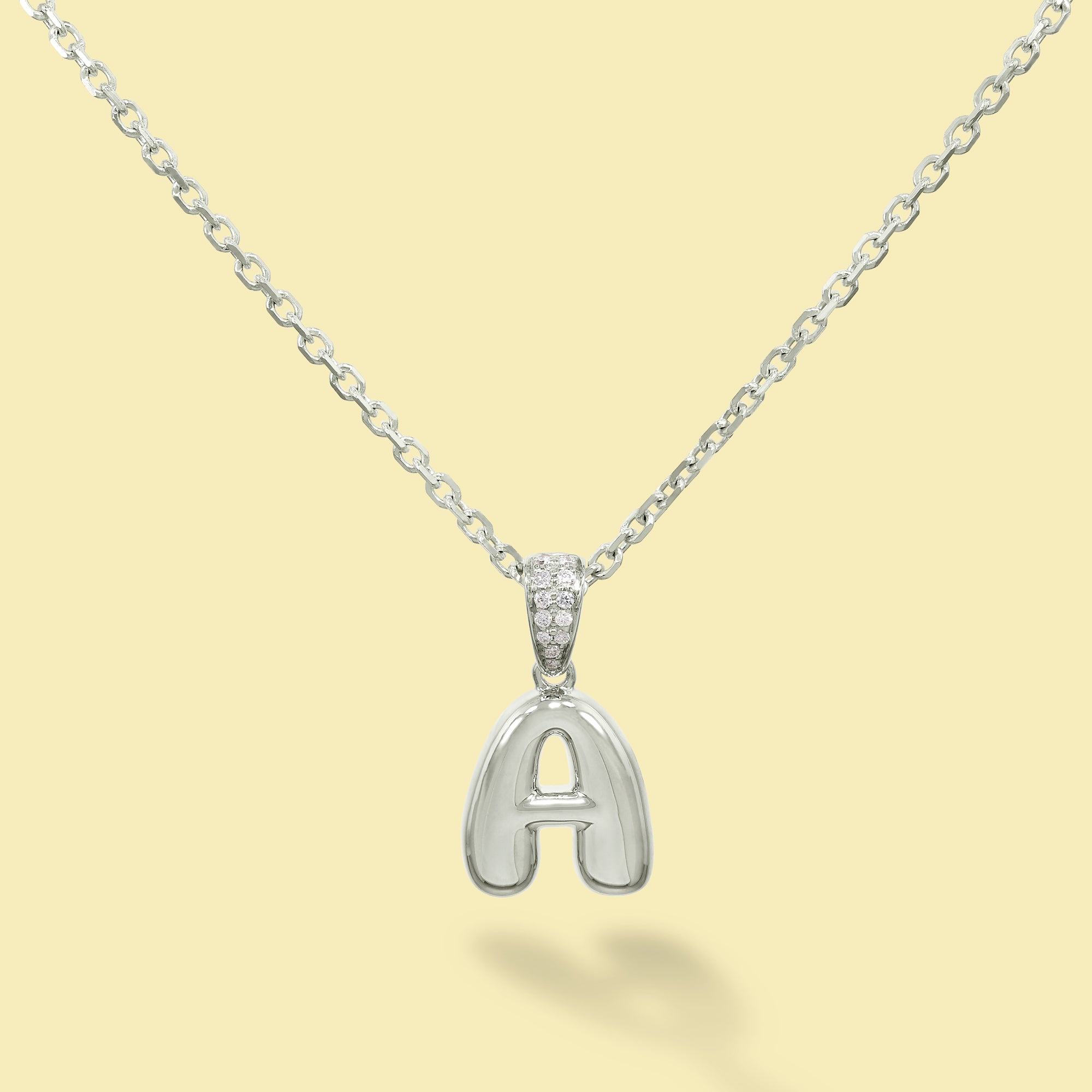 The Cloud, Gold Initial Diamond Puff Pendant Necklace handcrafted in 14K Gold by Earthena Jewelry of Beverly Hills, California.