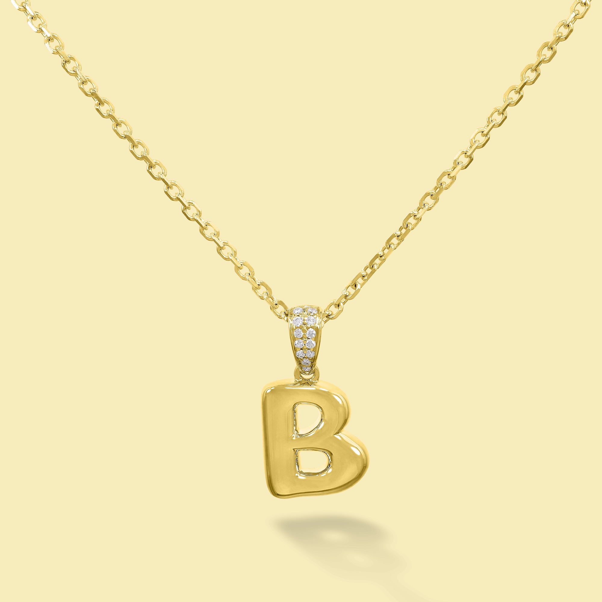 The Cloud, Gold Initial Diamond Puff Pendant Necklace handcrafted in 14K Gold by Earthena Jewelry of Beverly Hills, California.